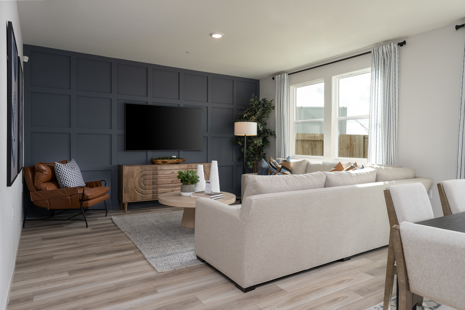 A living room with a tv and couches.