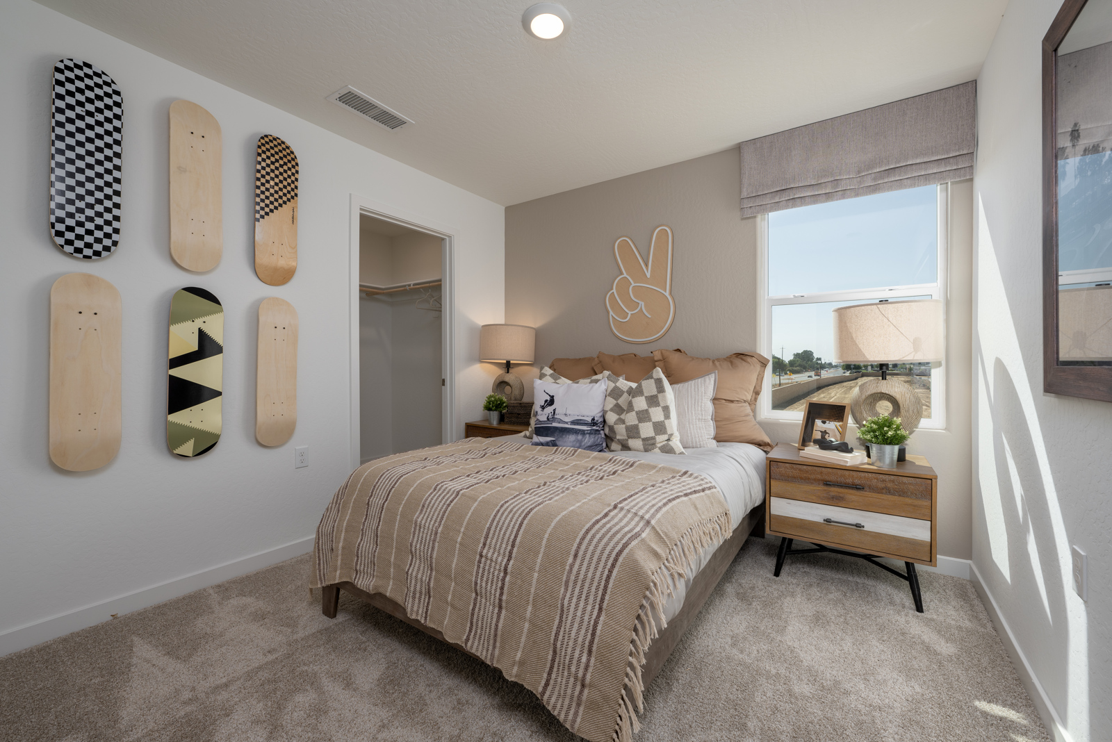 A bedroom with a bed and a table.