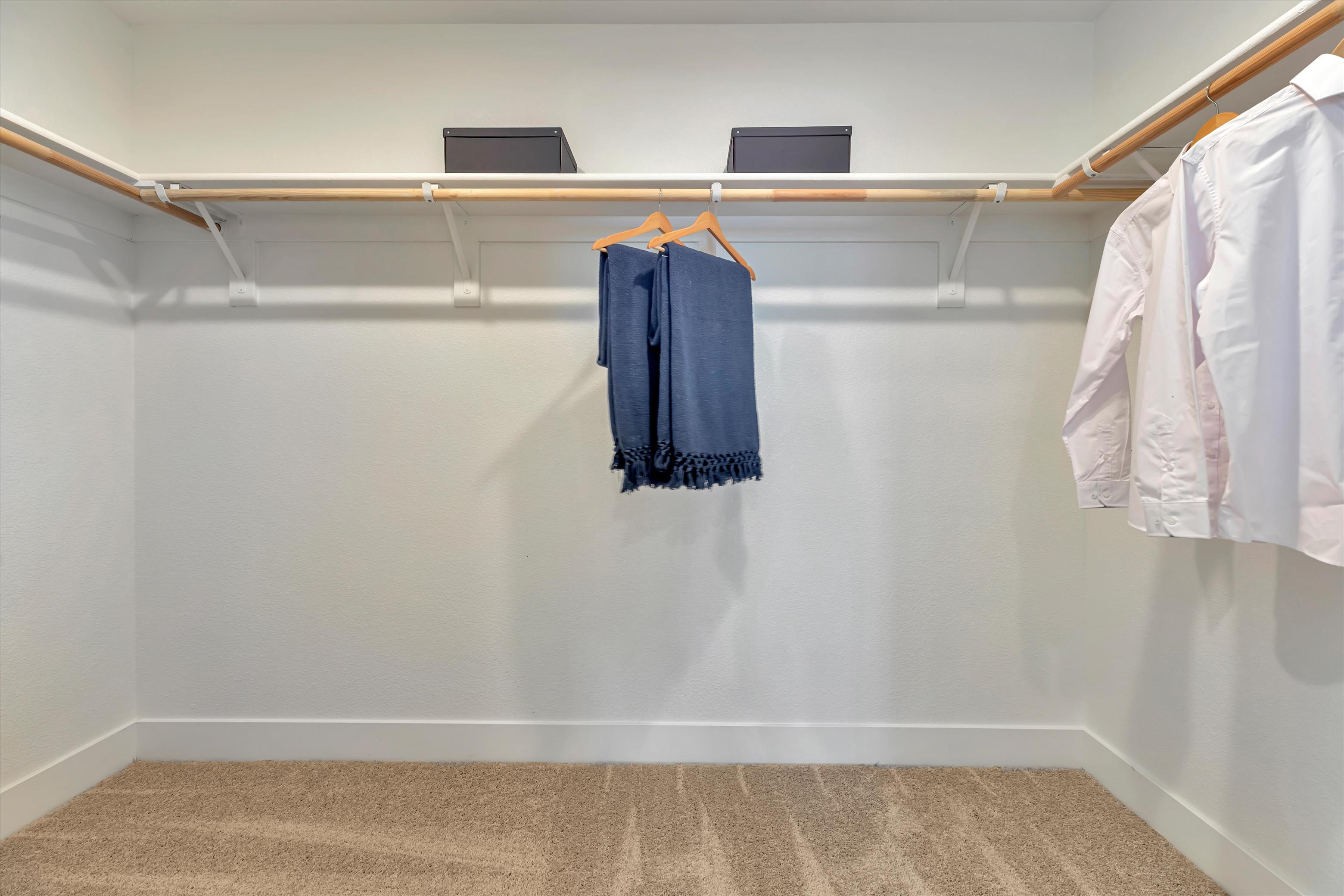 A row of white towels on a rack.