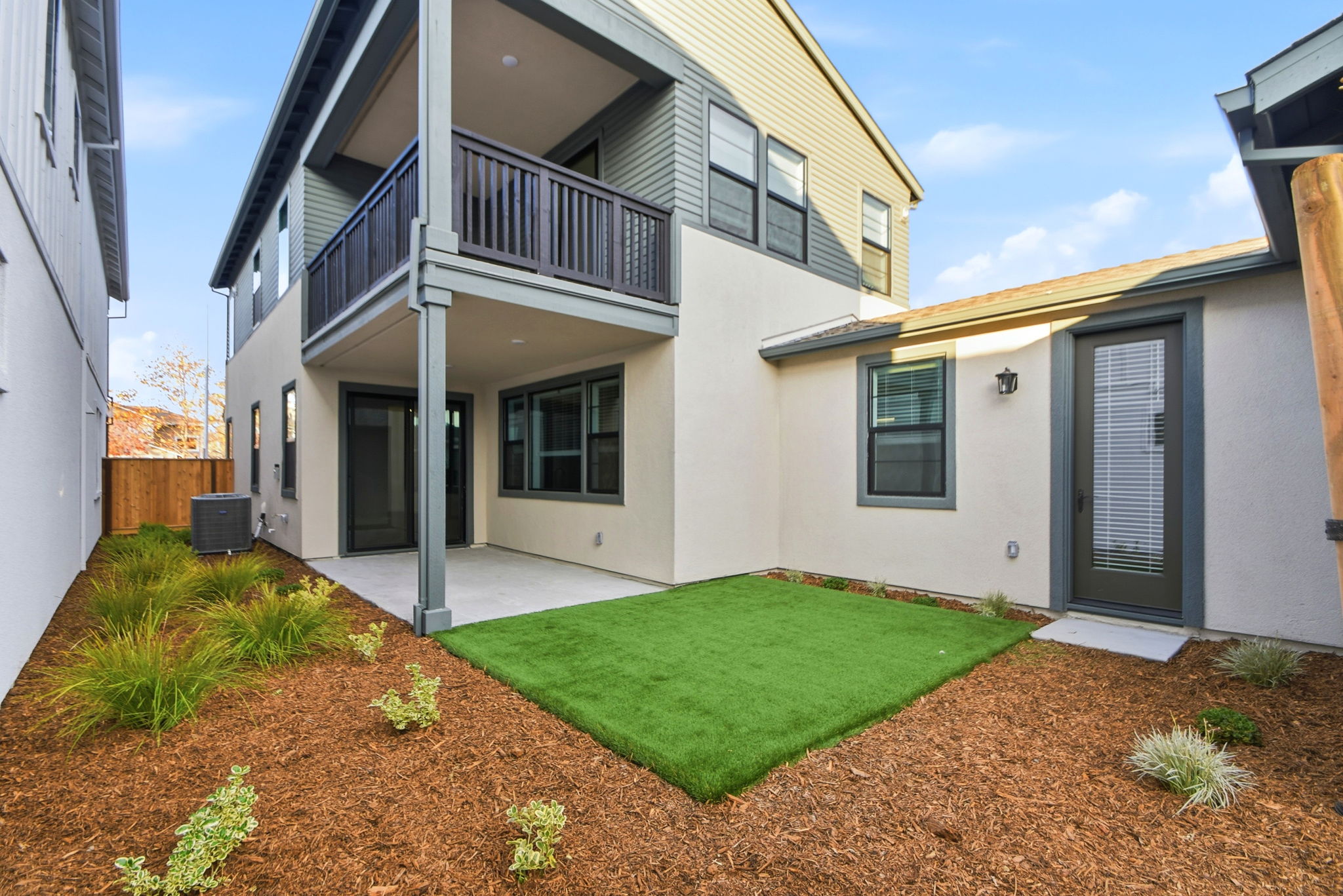 A house with a green lawn.
