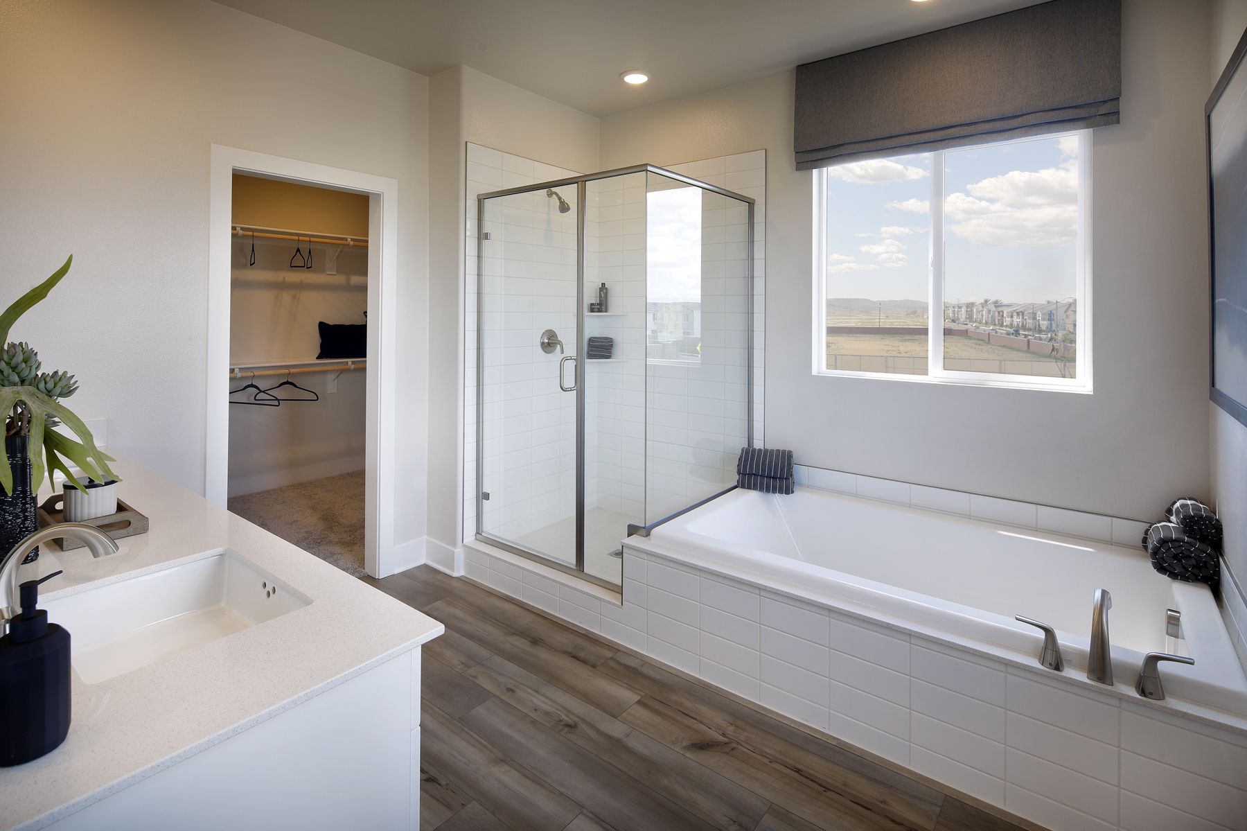 A bathroom with a tub and sink.