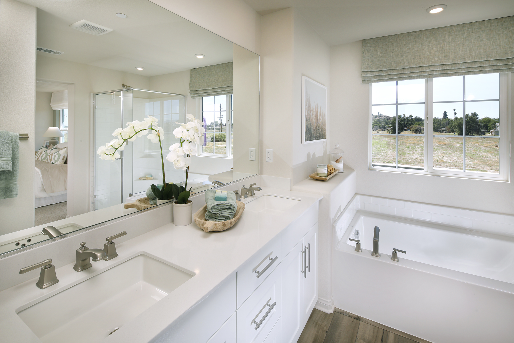 A bathroom with a large mirror.