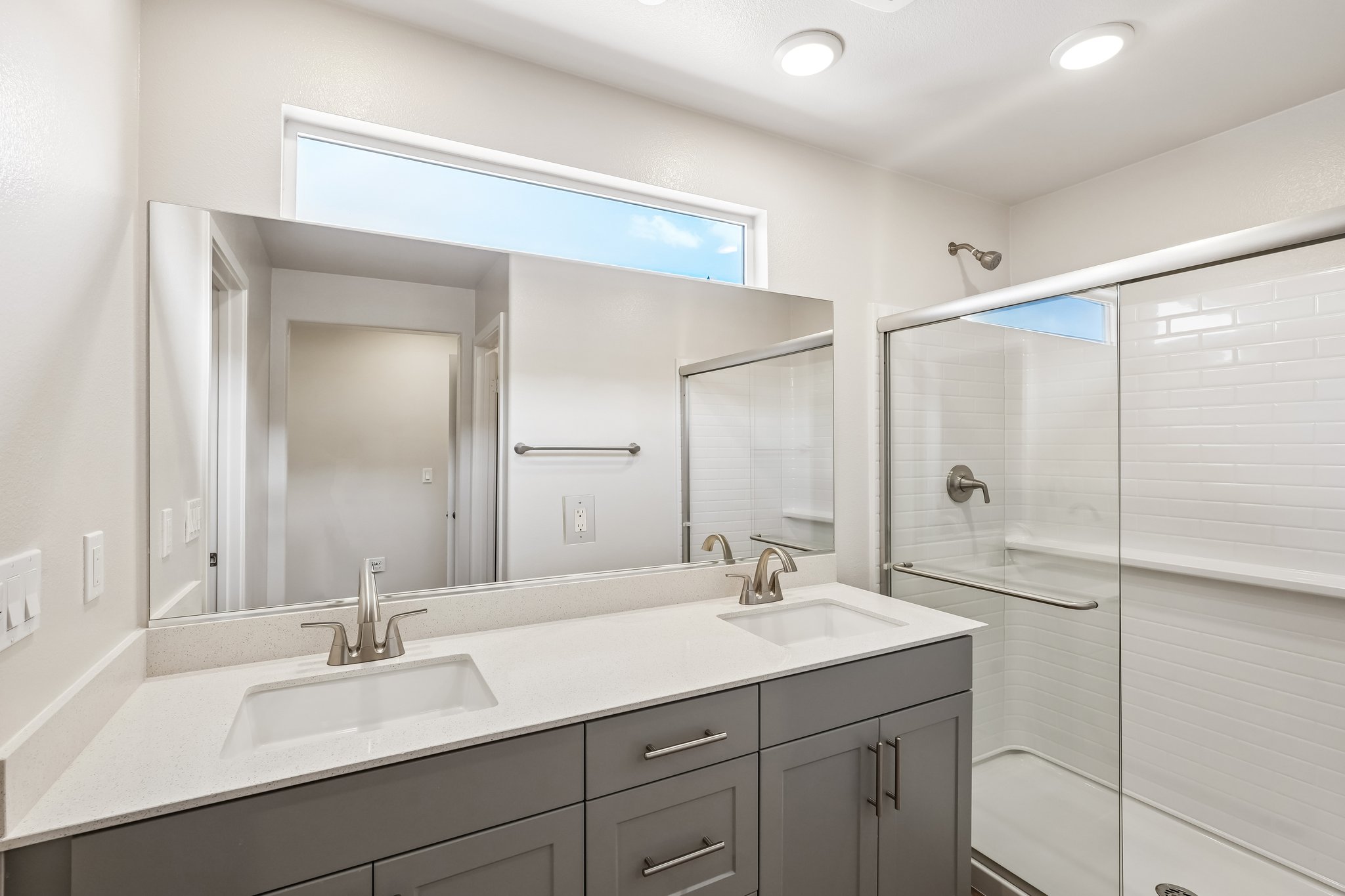 A bathroom with a glass shower.