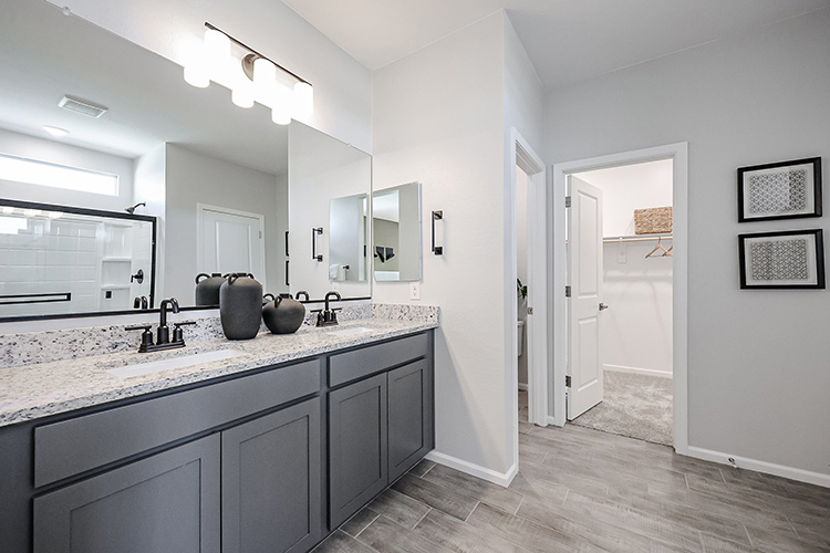 A bathroom with a marble countertop.