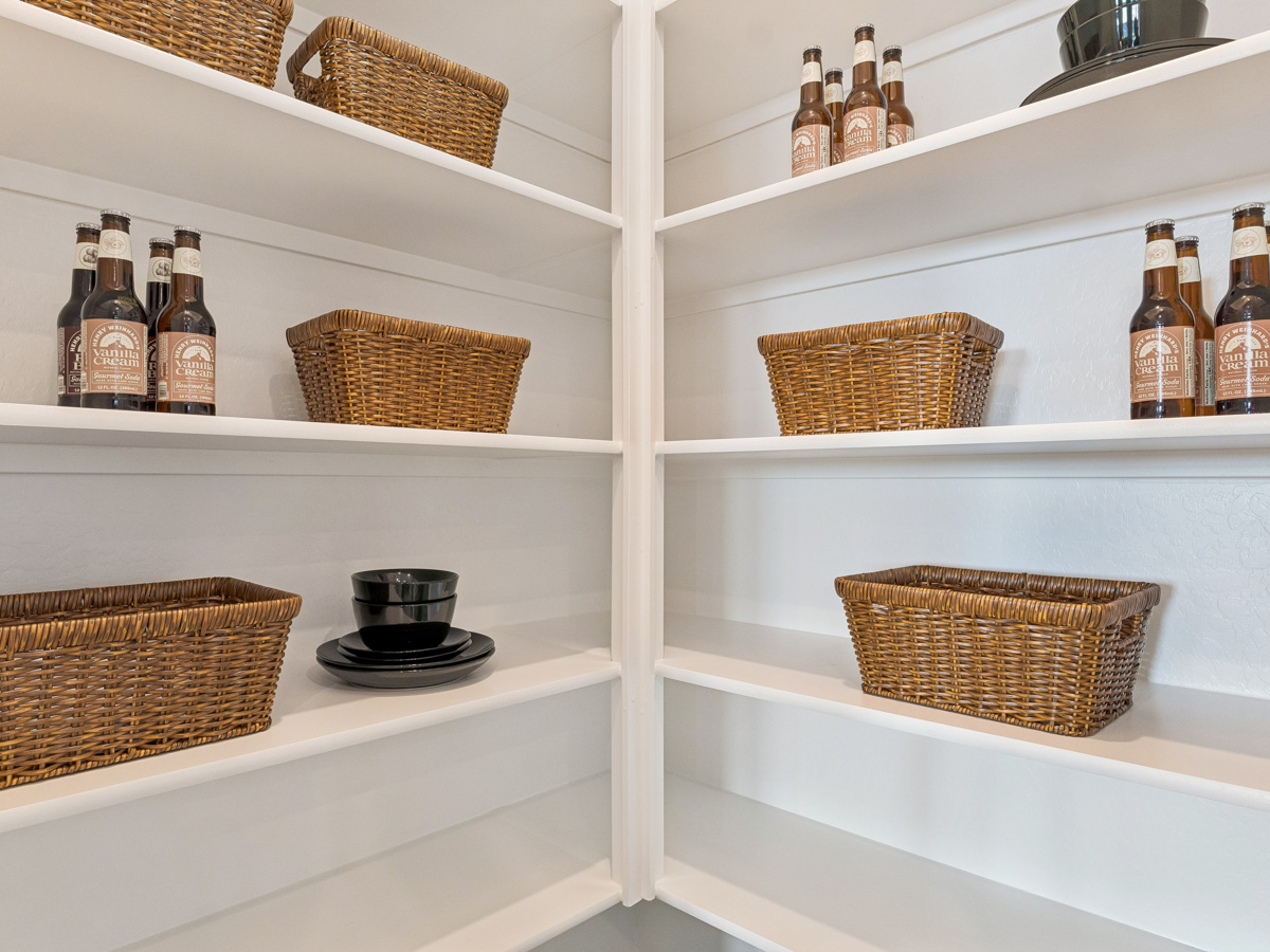 A white shelving unit with various items on it.