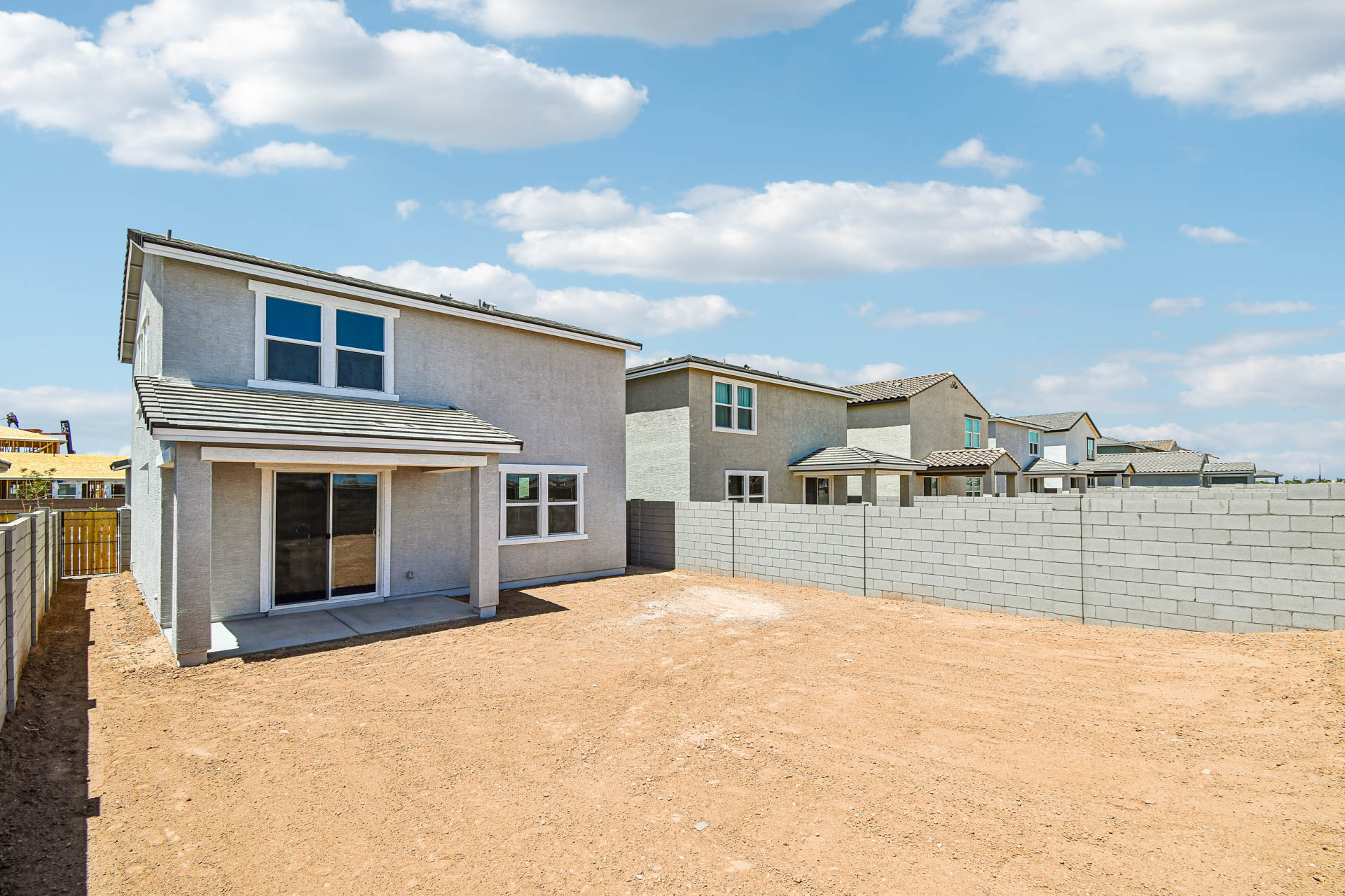 A house with a dirt yard.