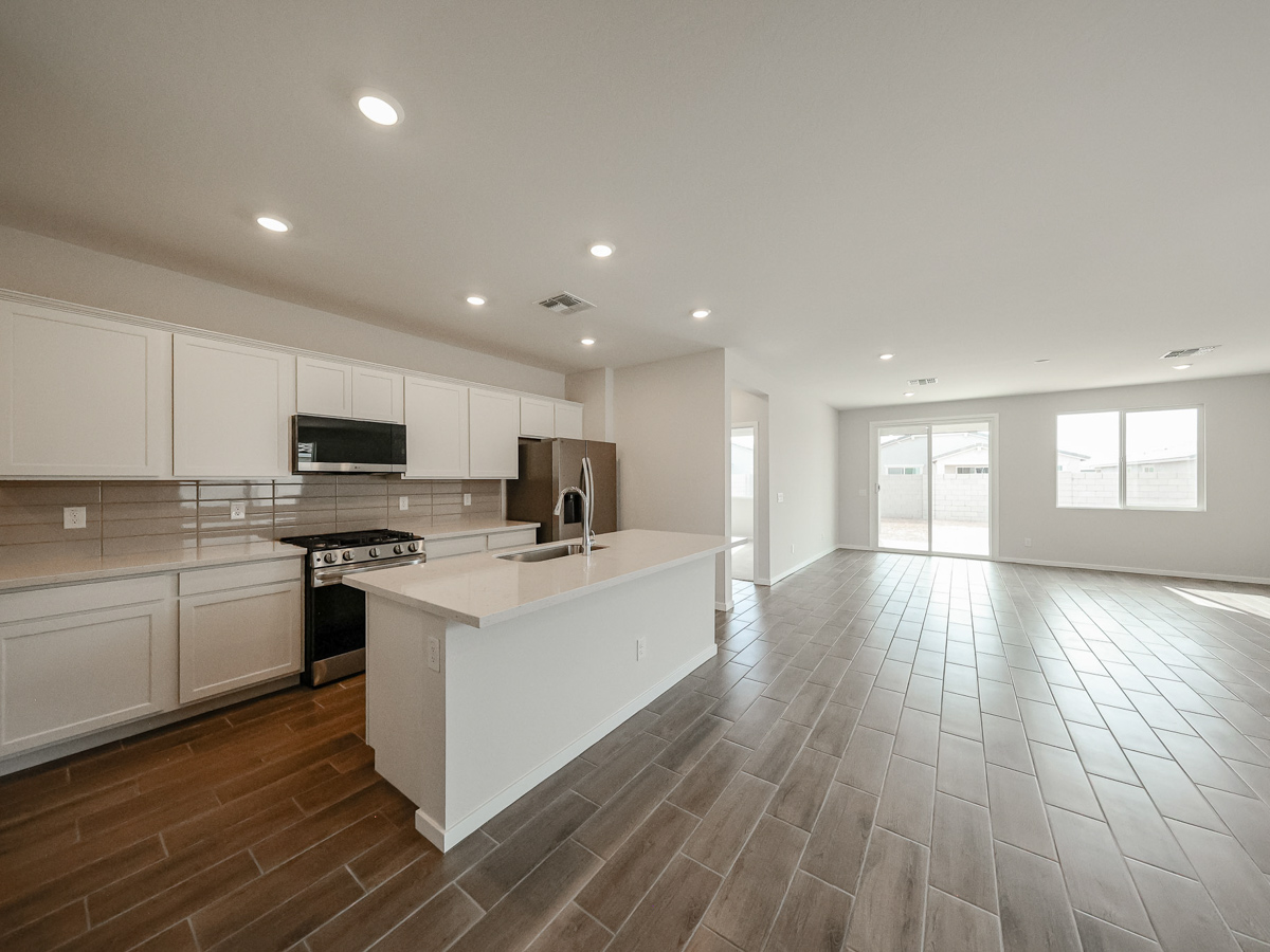 A large kitchen with white cabinets.