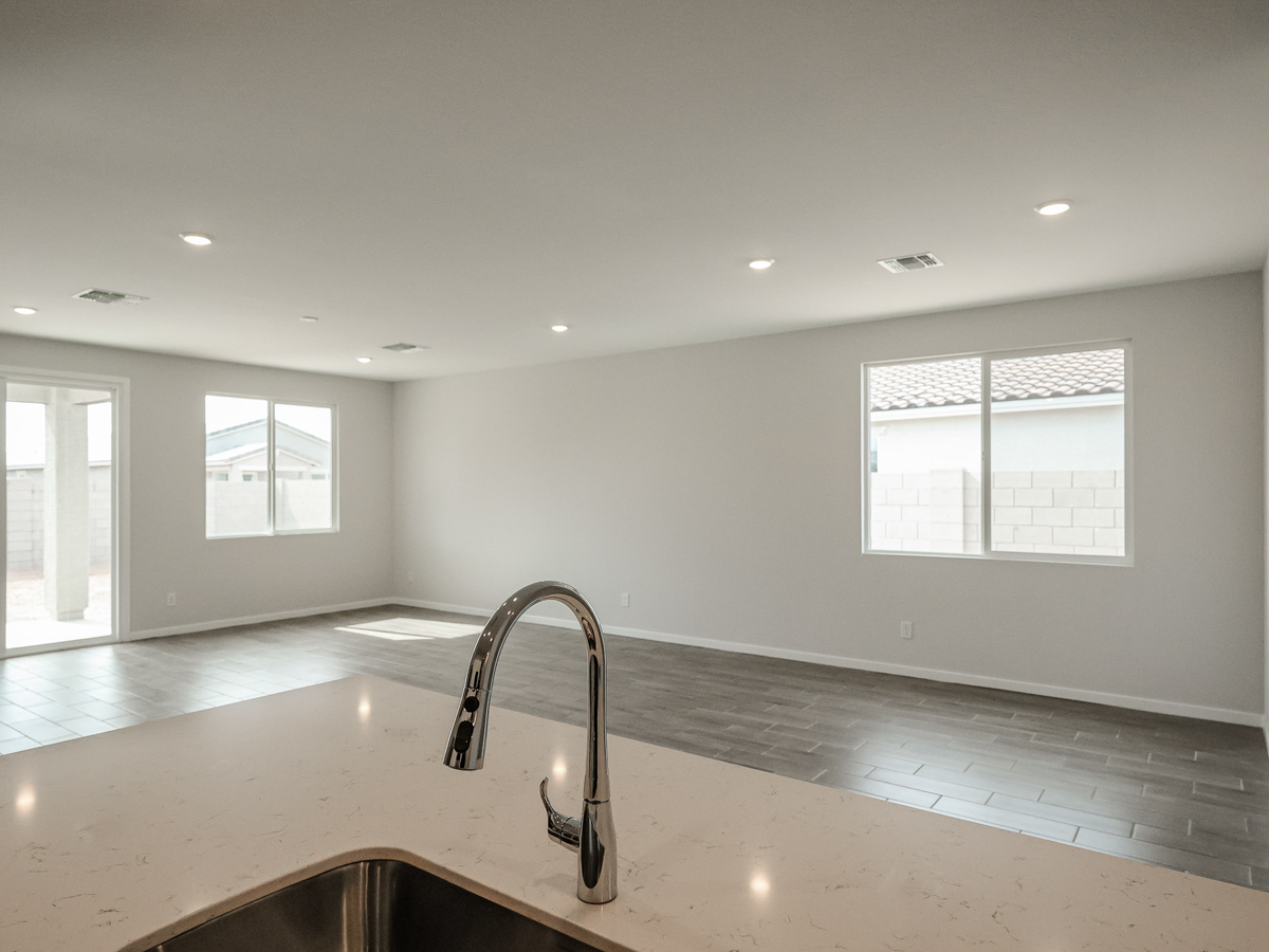A kitchen with a sink and a faucet.