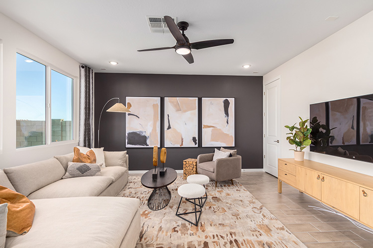 A living room with a large television and a large window.