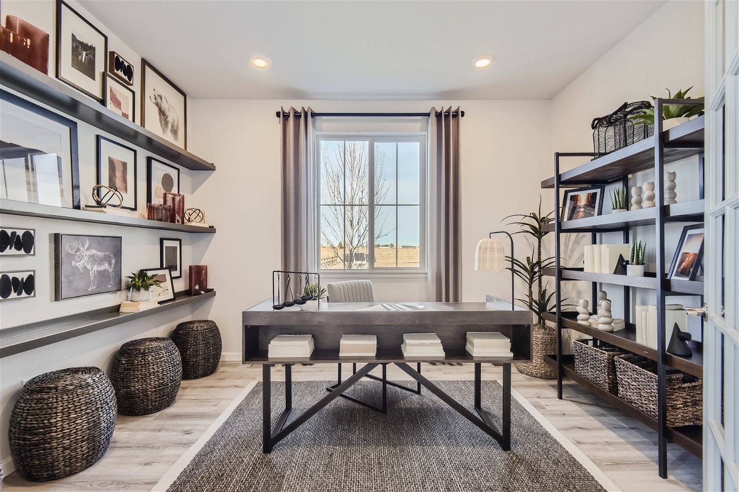 A room with a table and shelves.