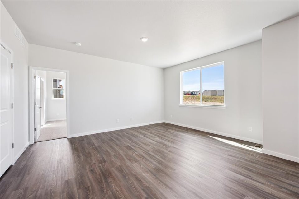 A room with a wood floor and a wood floor.
