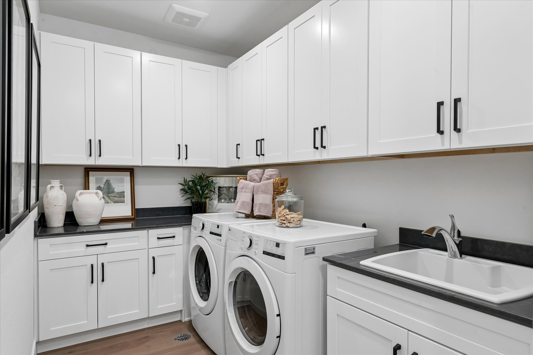 A white kitchen with white cabinets.