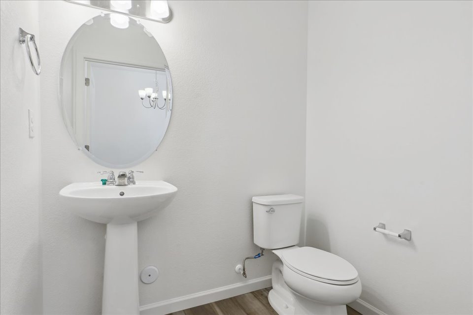 A bathroom with a sink and toilet.