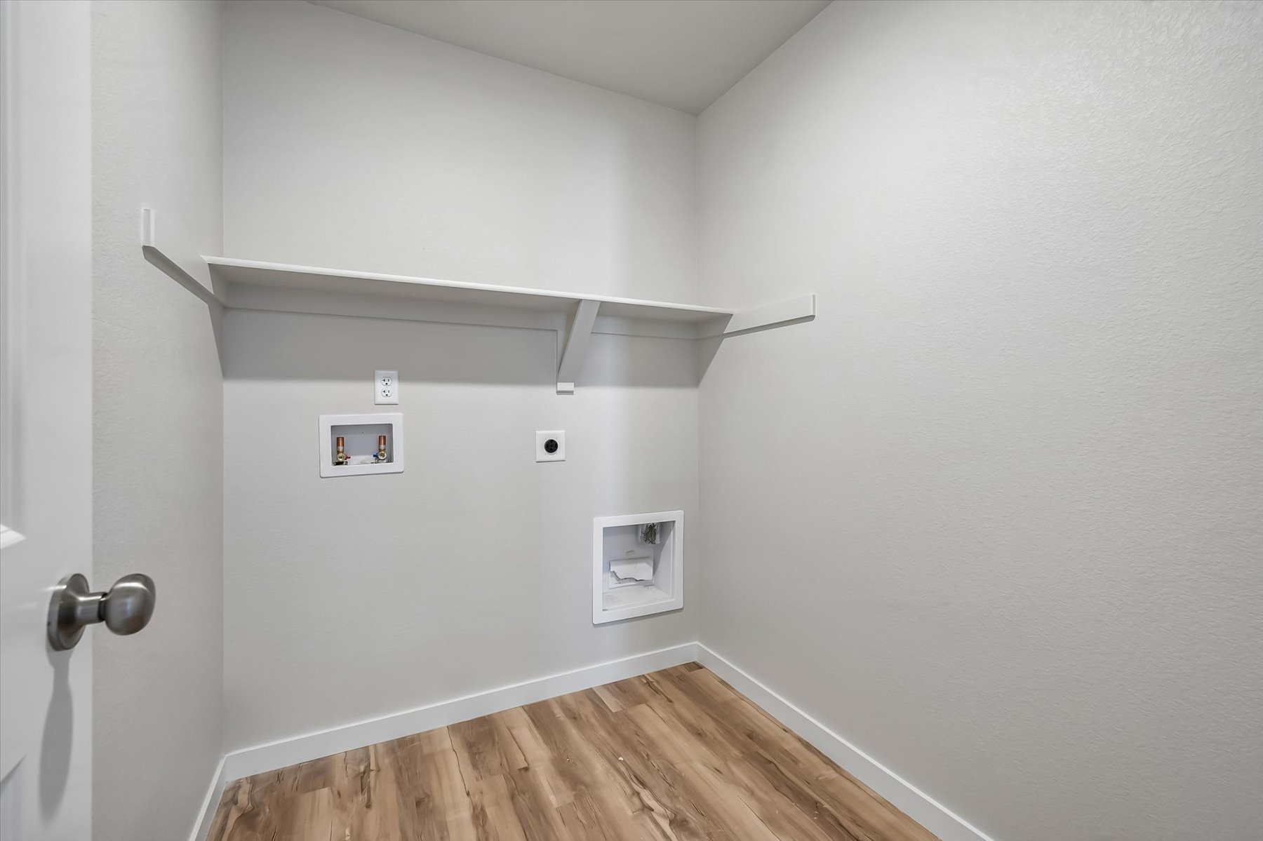 A room with a wood floor and a wood floor.