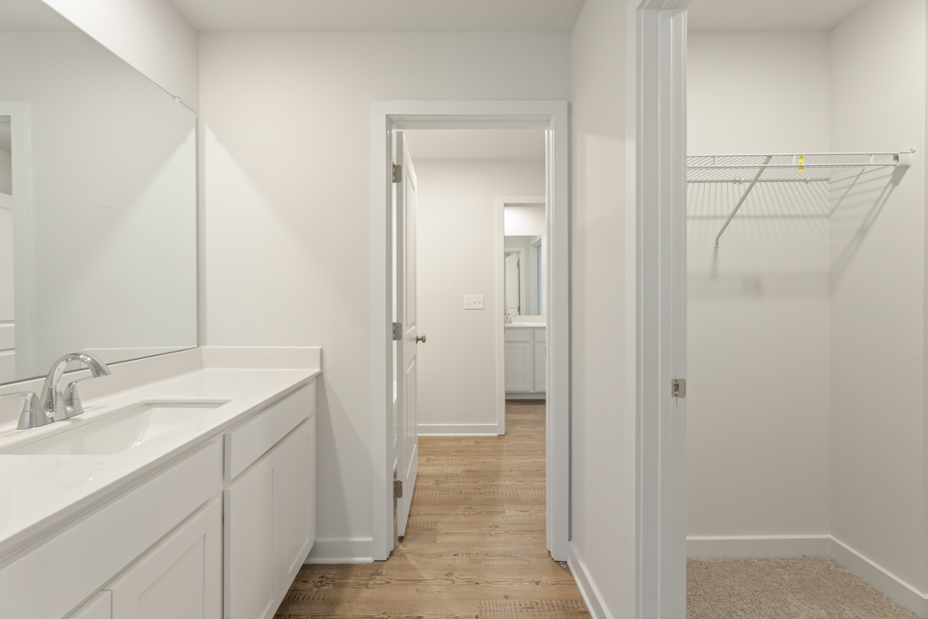 A bathroom with white walls.