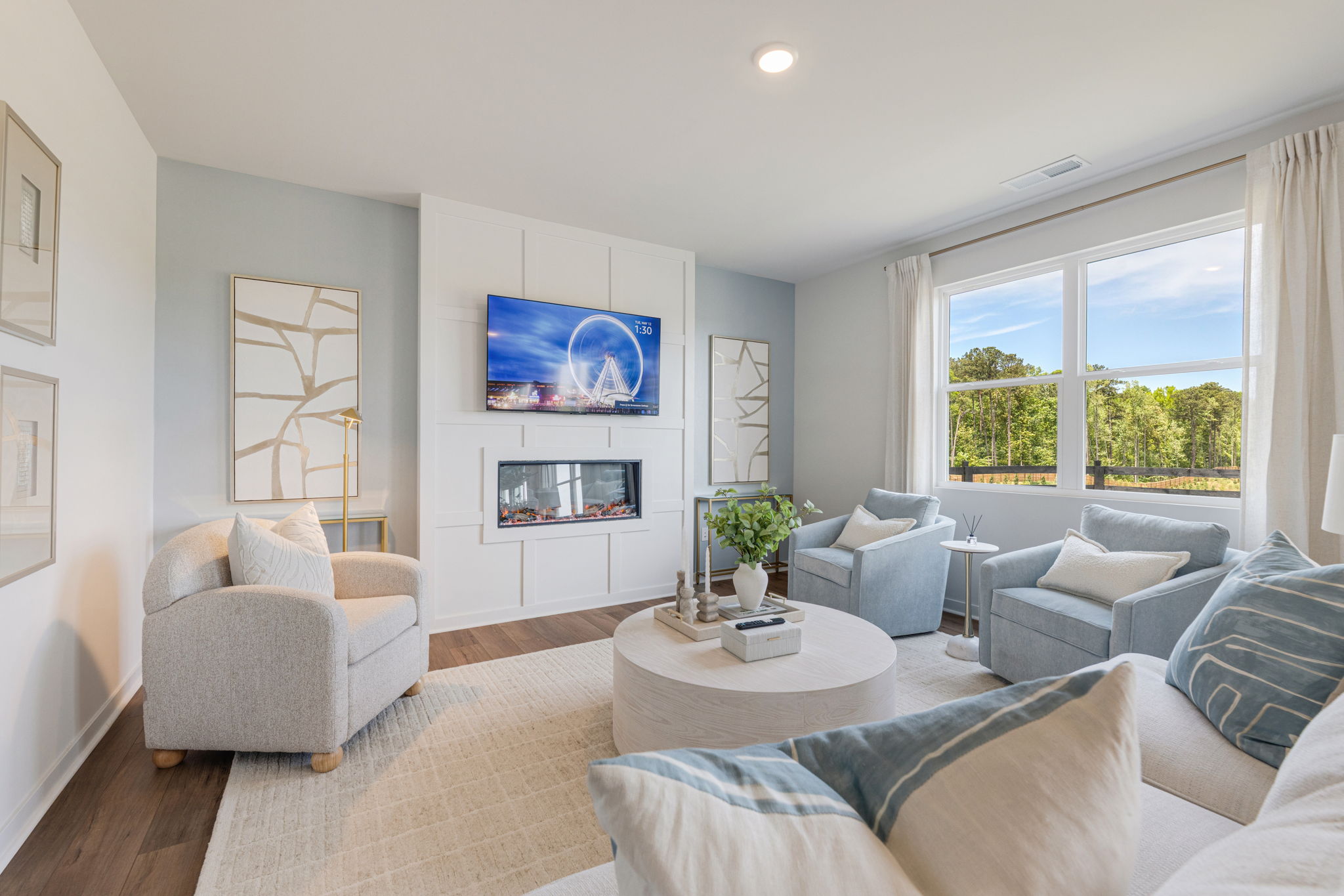 A living room with a large window.
