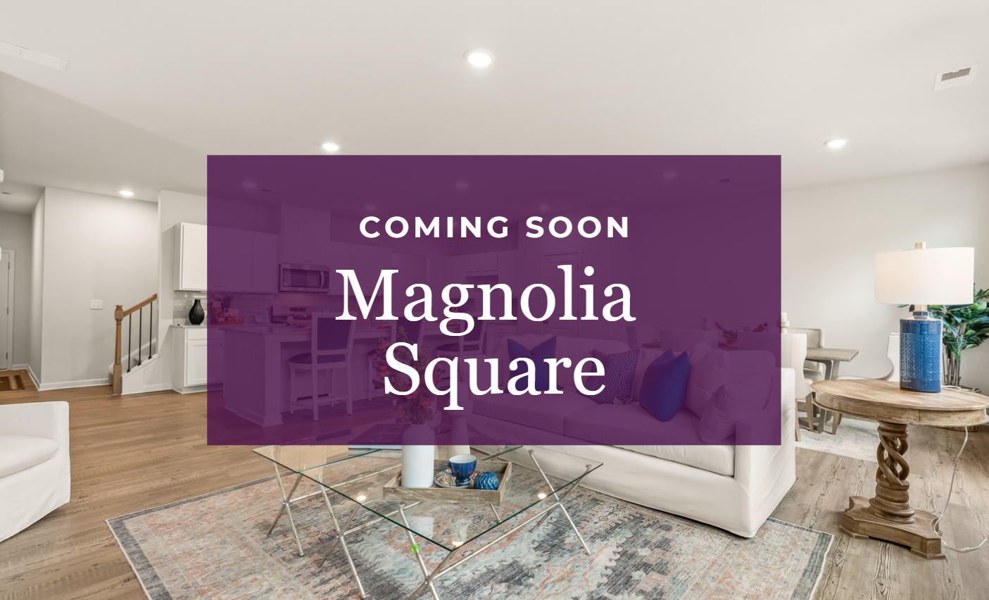 A room with a couch and a table with a lamp and a wall with a purple wall with.