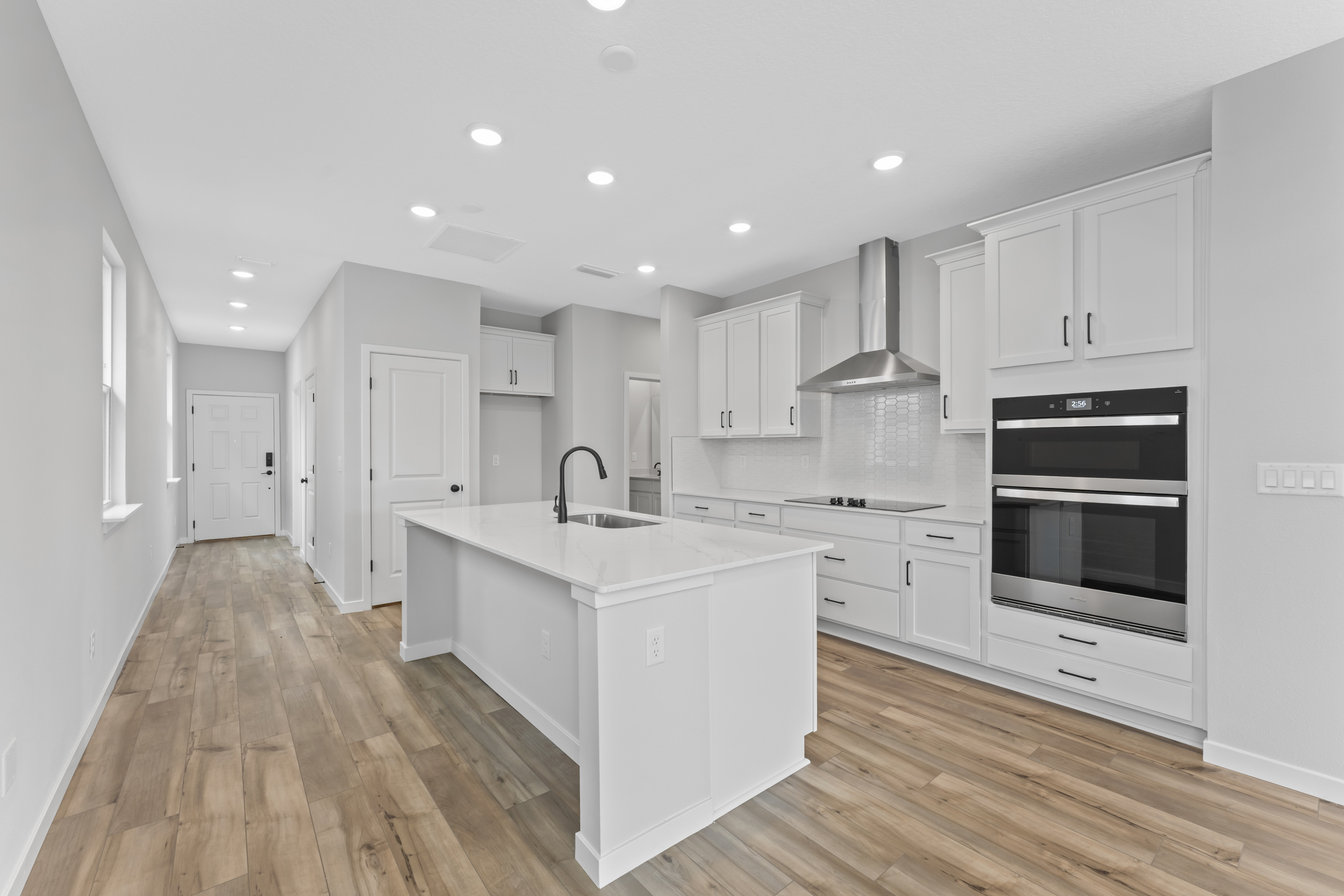 Miramar Floorplan Lot 81 Chef's Kitchen with White Cabinets at Concourse Crossing in Fernandina Beach