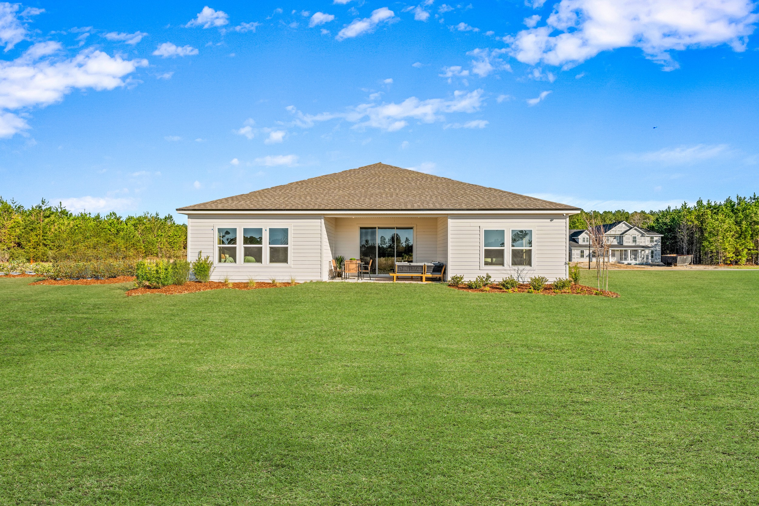 A house with a grass yard.