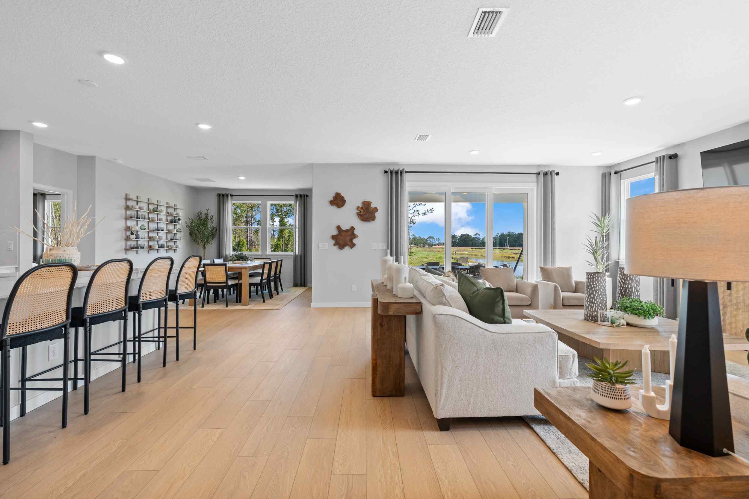 A living room with a wood floor.