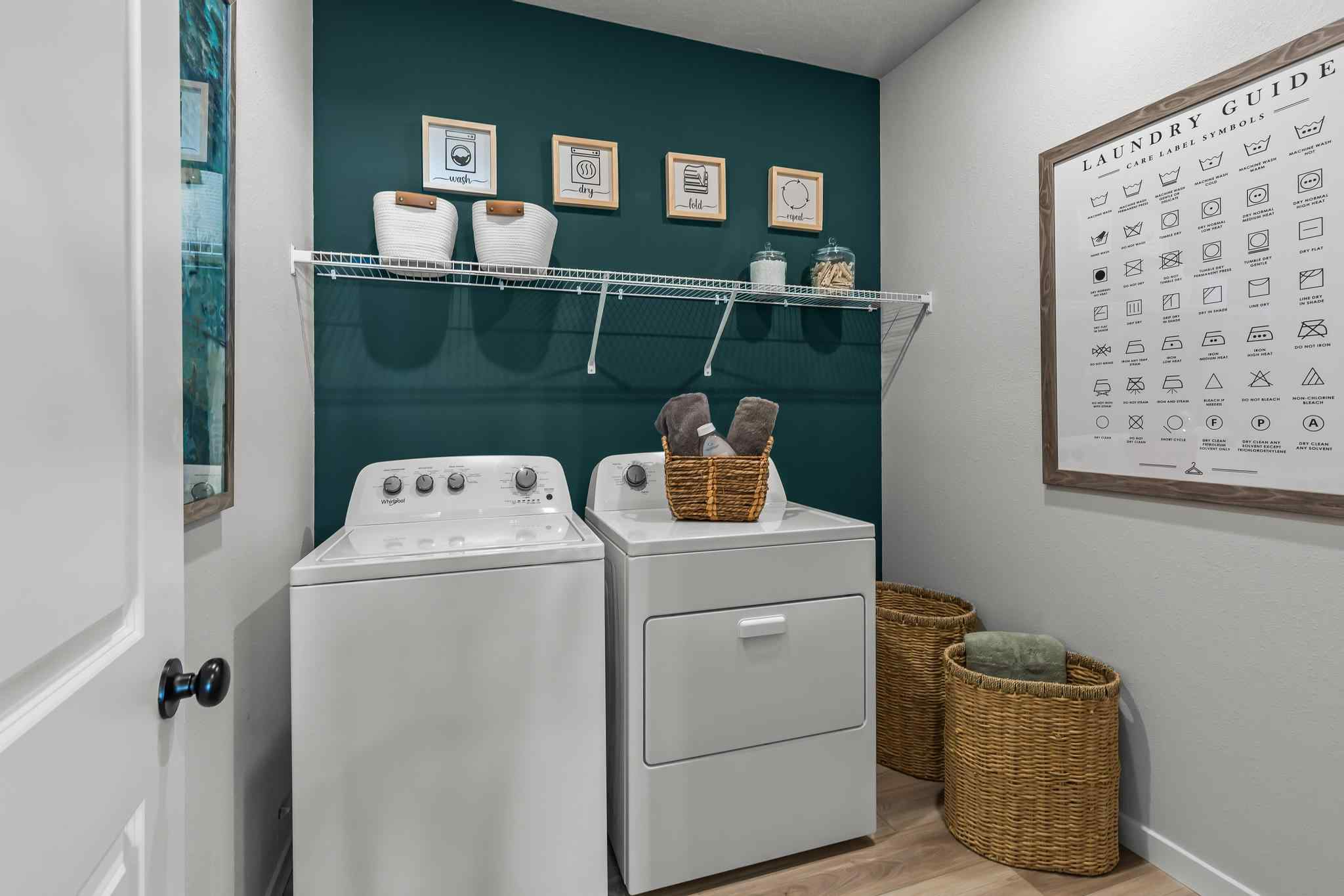 A laundry room with a washer and dryer.