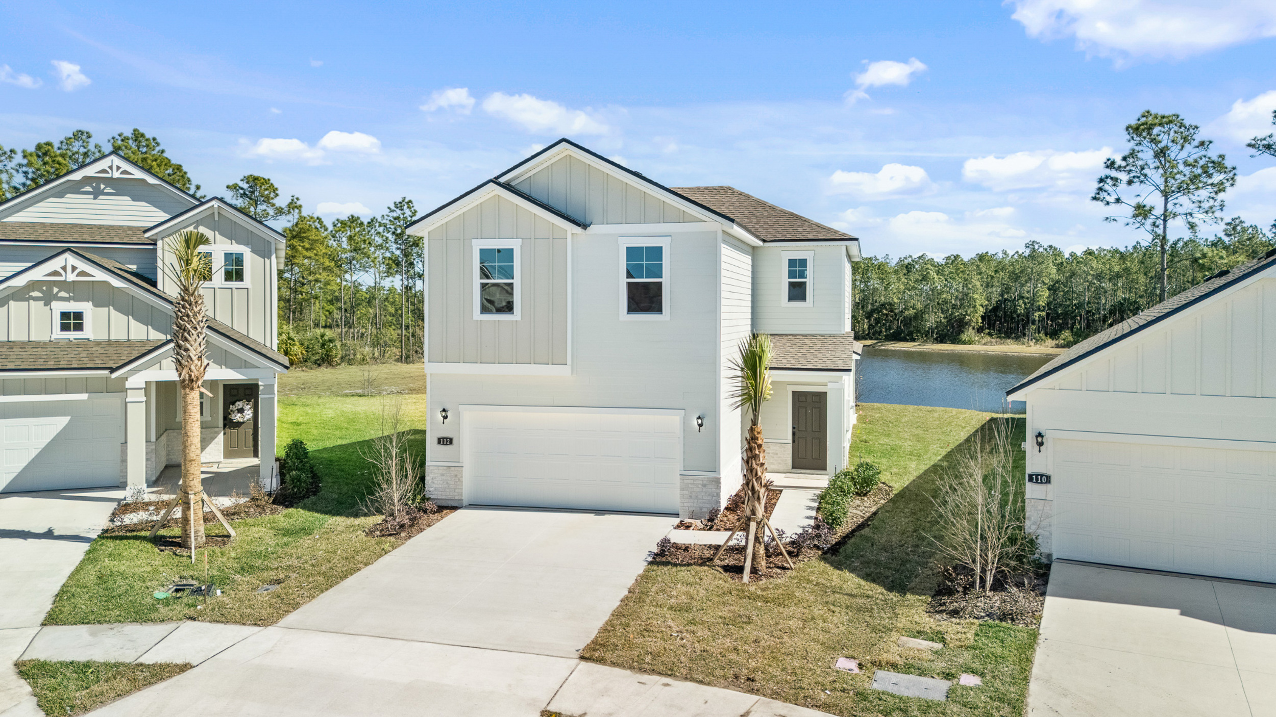 Lot 65 Front Exterior with Pond Behind Home at Seminole Palms