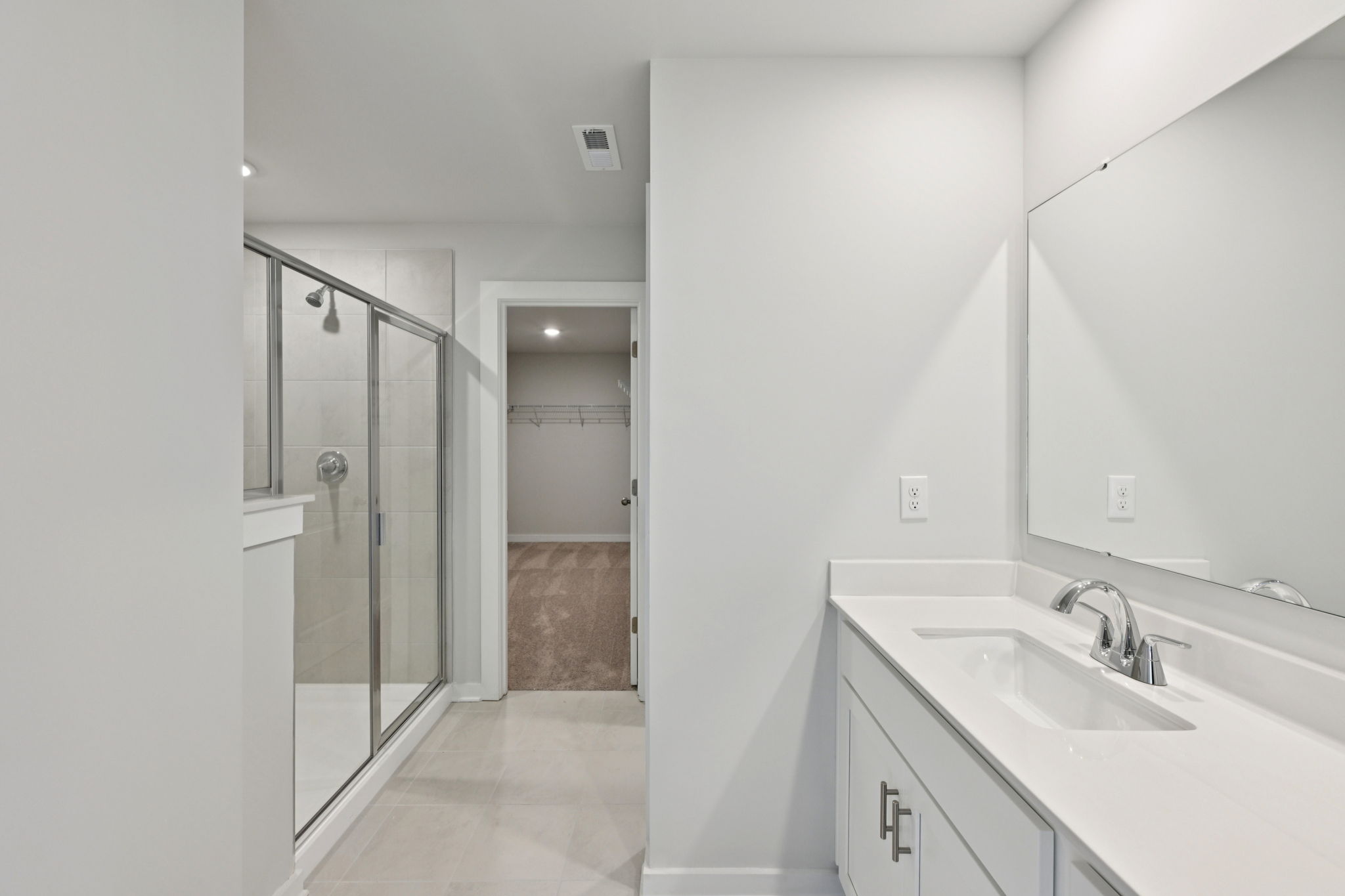 A bathroom with a glass shower.