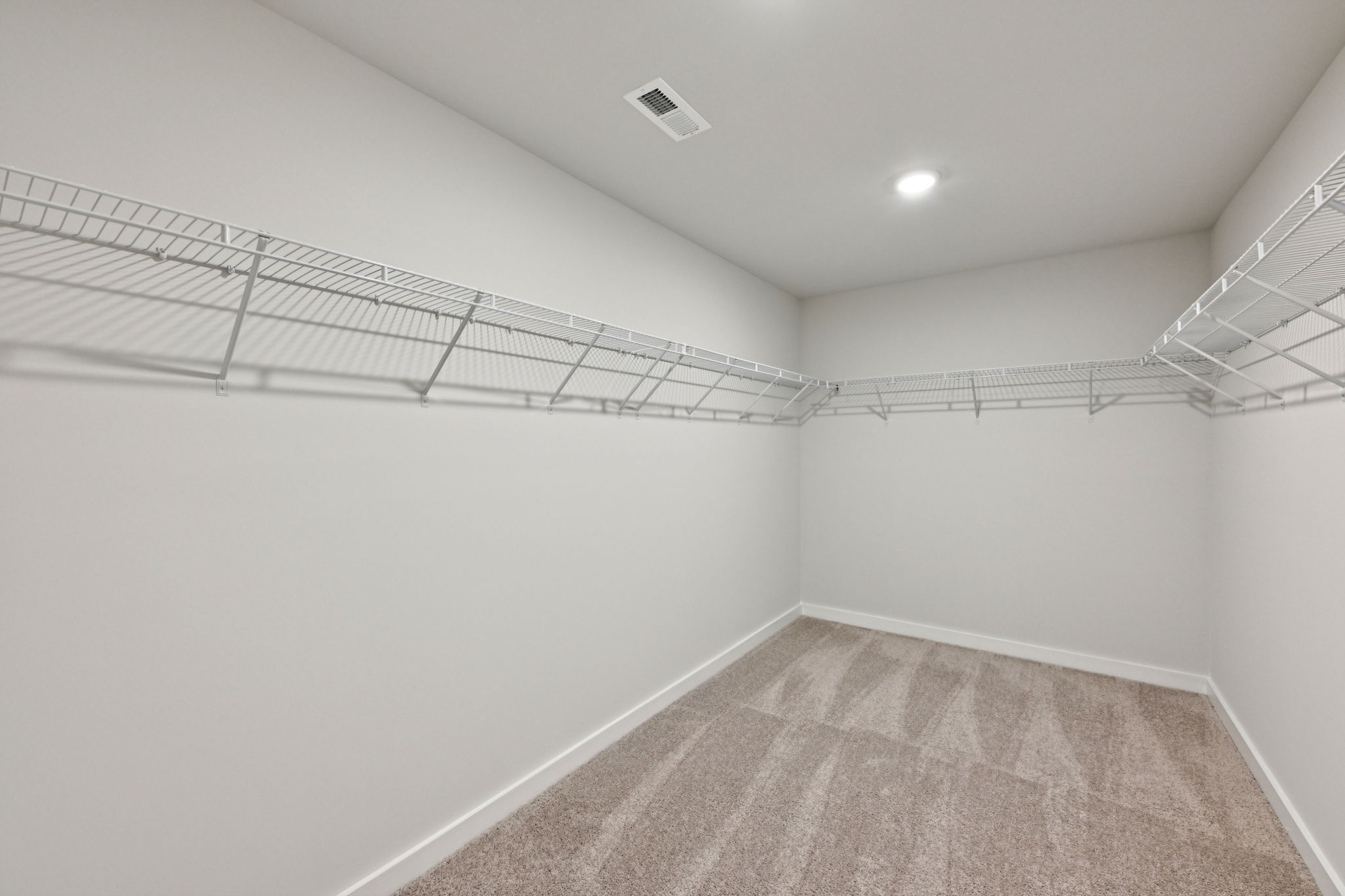 A hallway with white walls.