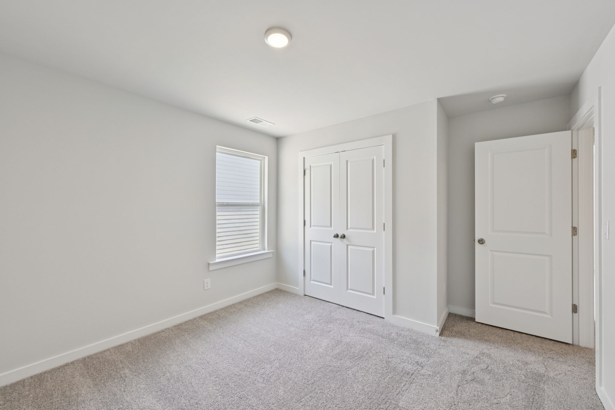 A room with white doors.