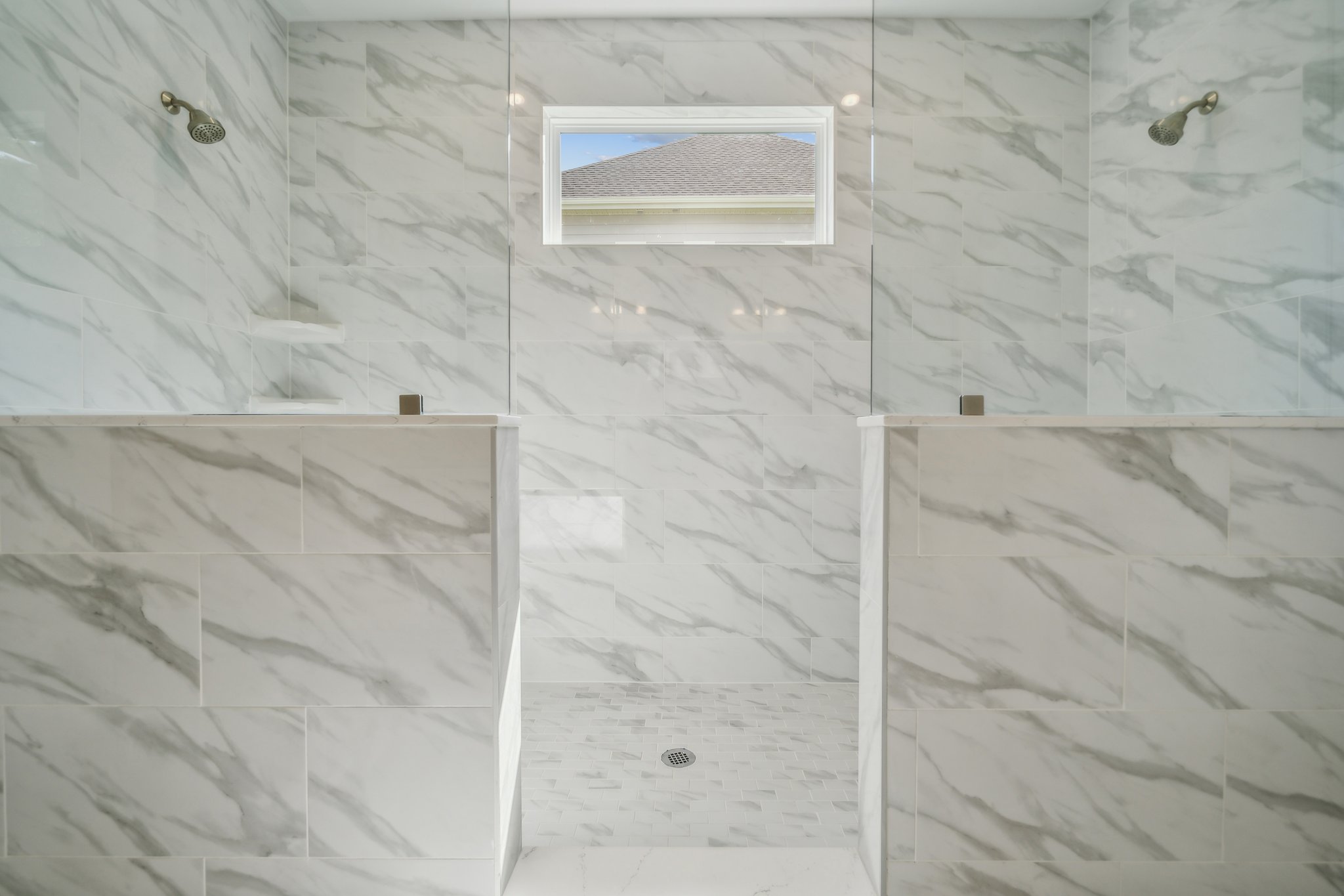 A room with a bed and a window.