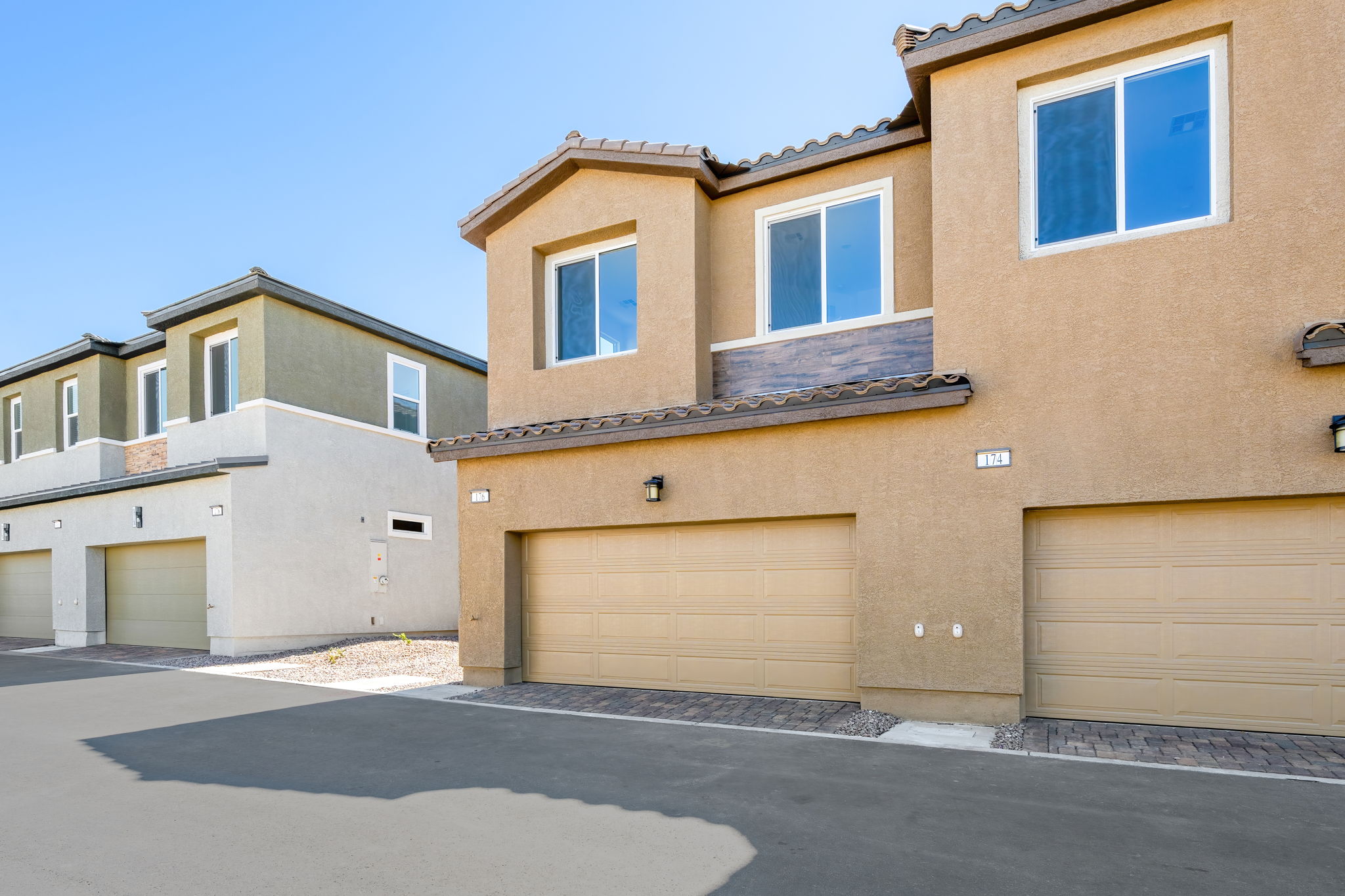 A building with garages and a blue sky.