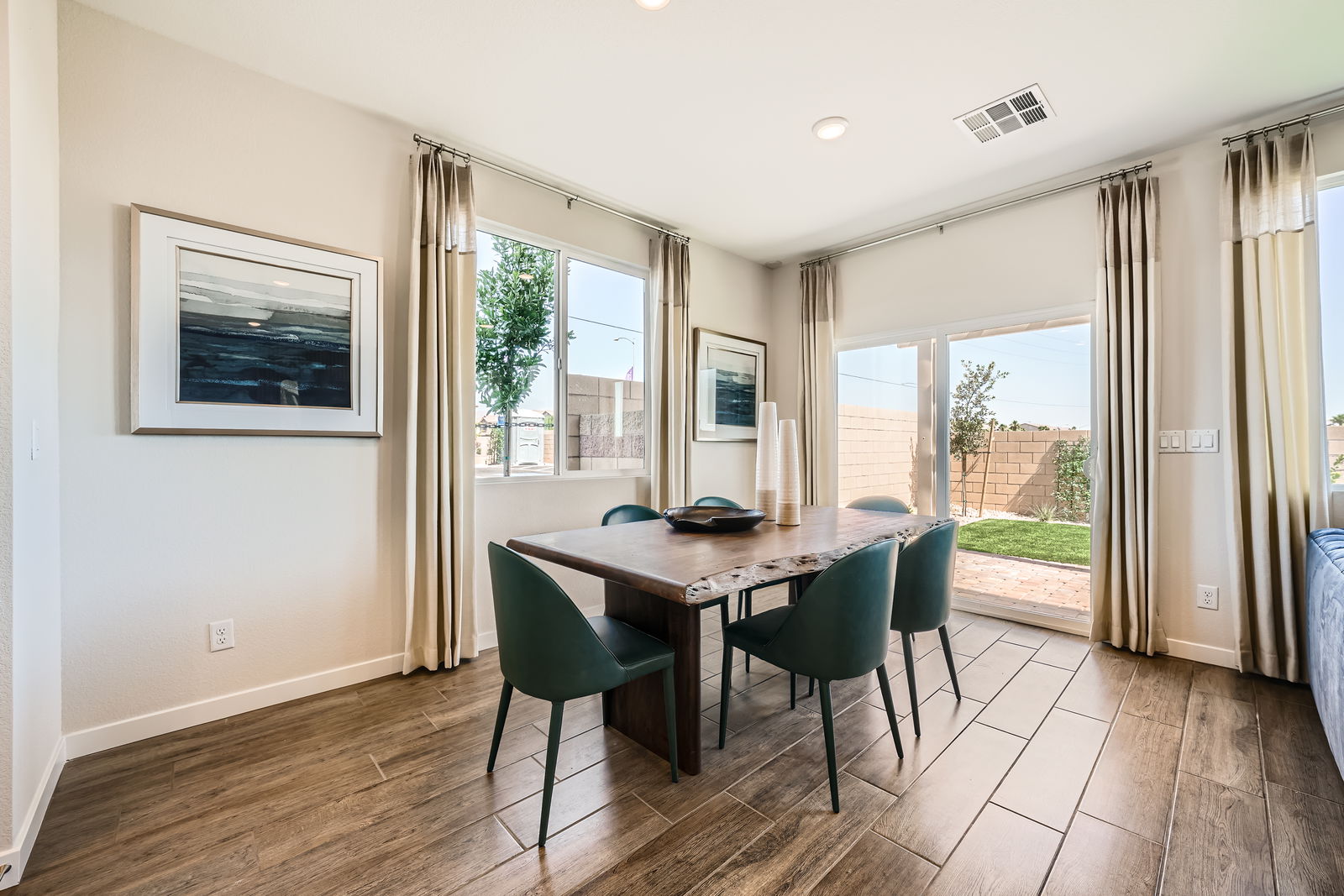 A dining room table with chairs.