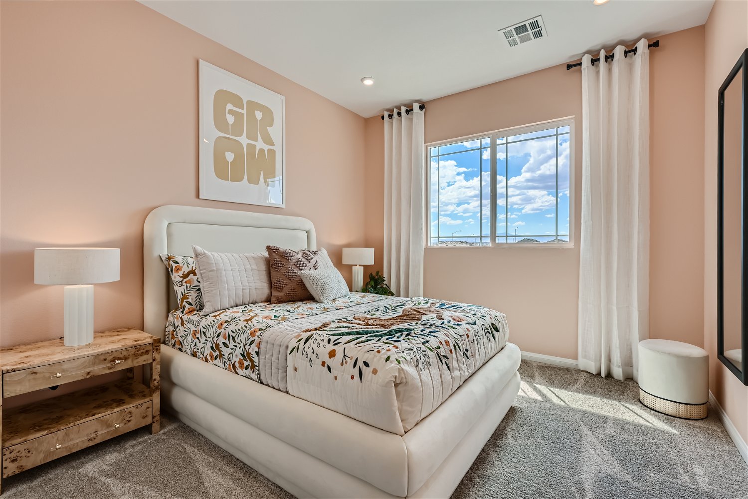 A bedroom with a bed and a window.