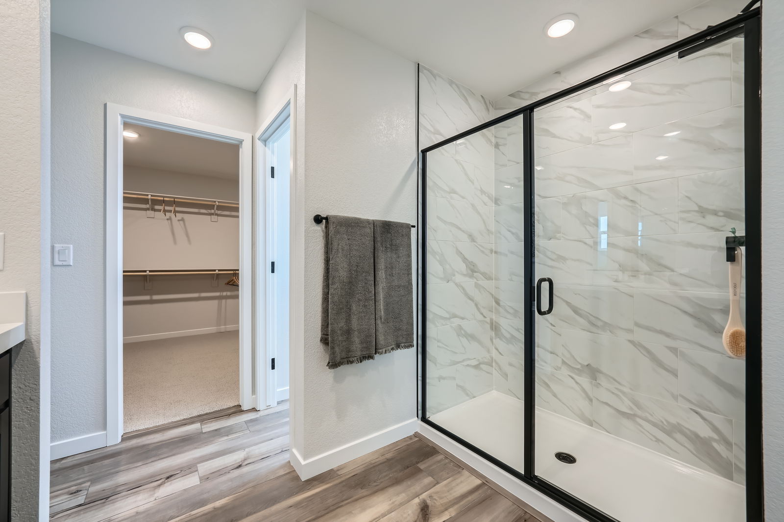 A bathroom with a glass shower.
