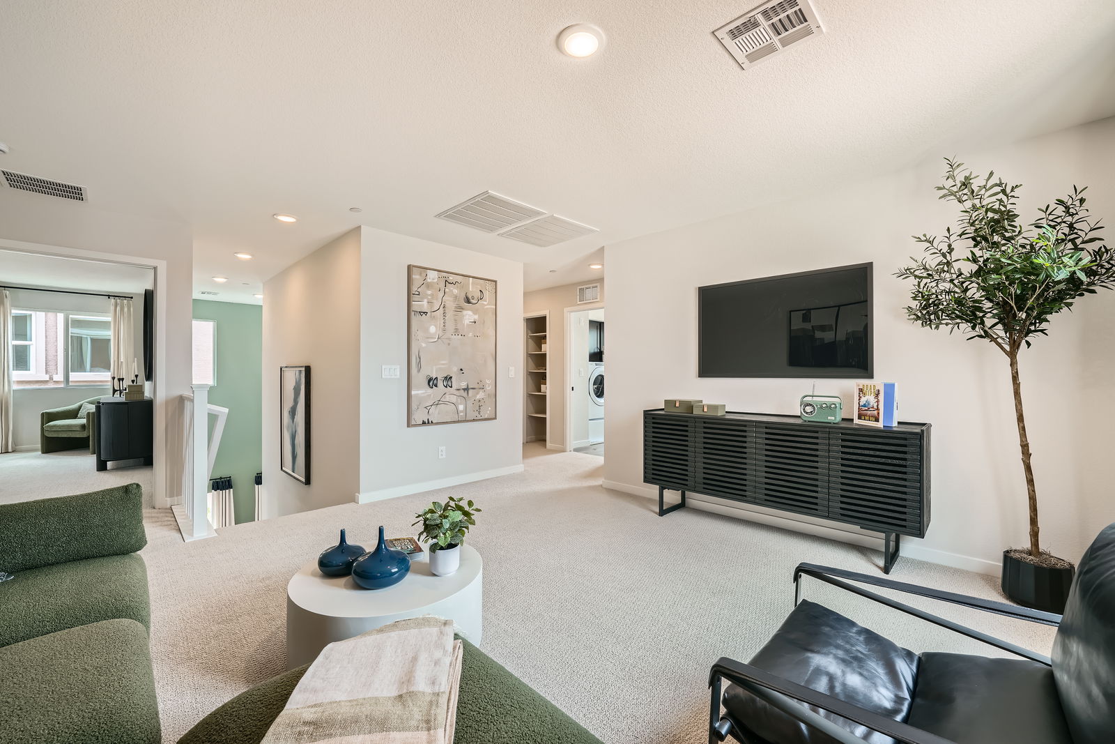 A living room with a tv and couches.