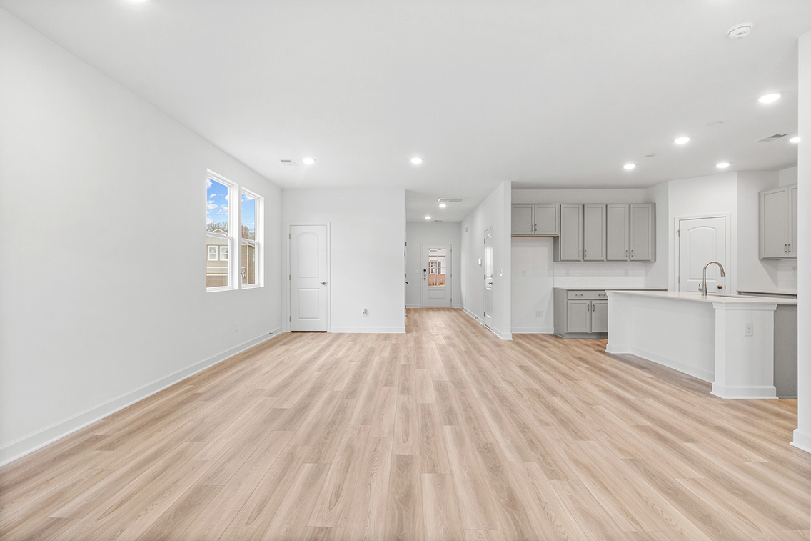 A large kitchen with white cabinets.