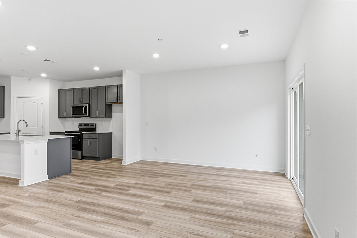 A kitchen with white walls.
