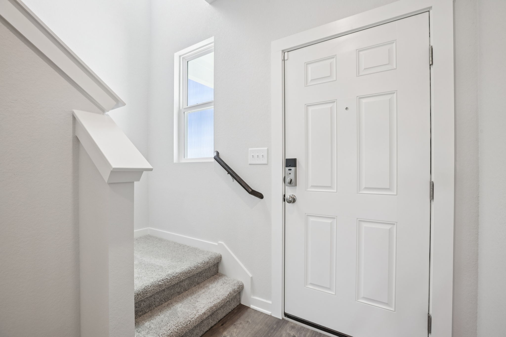 A white door with a window.