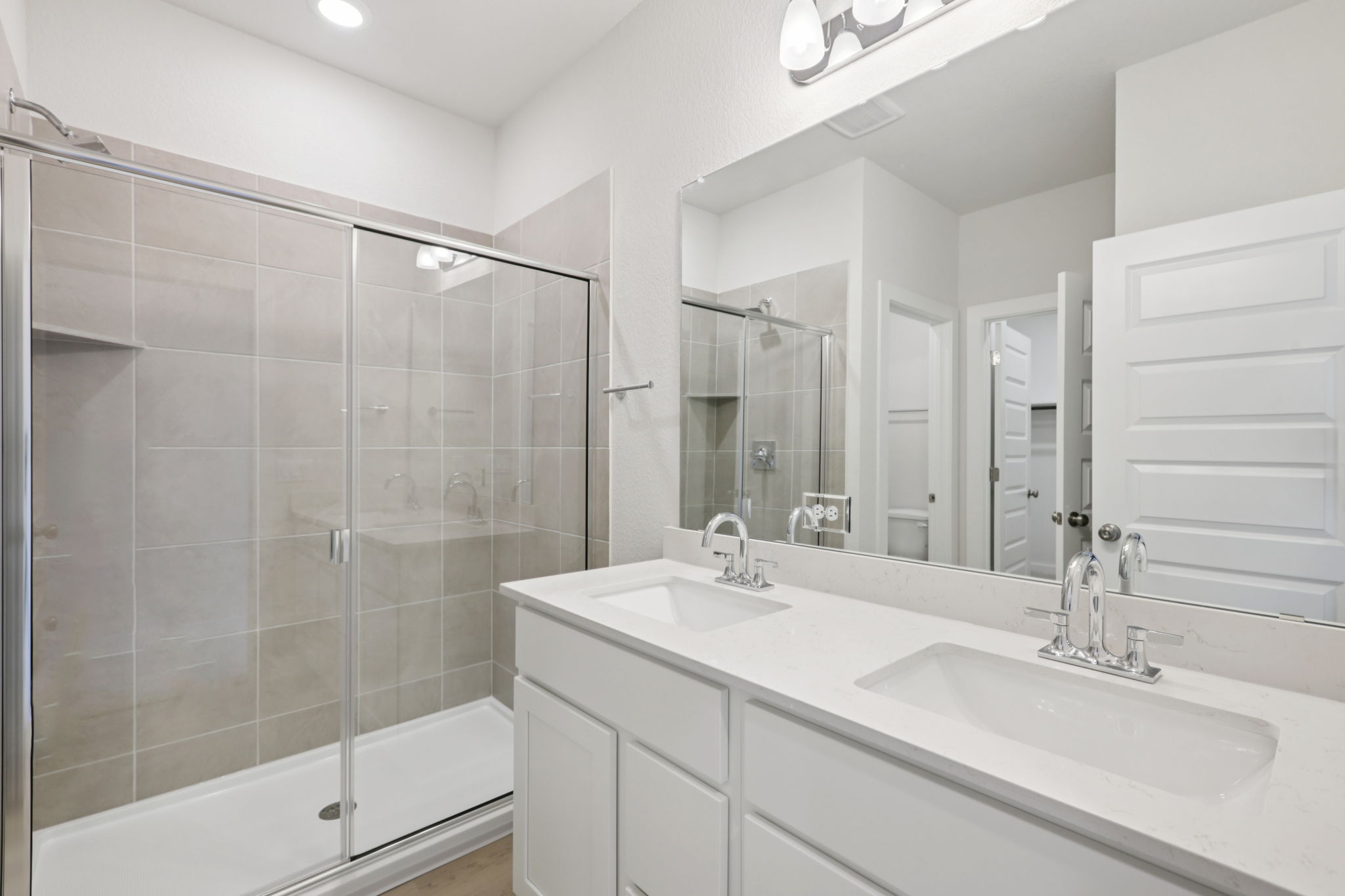A bathroom with a glass shower.