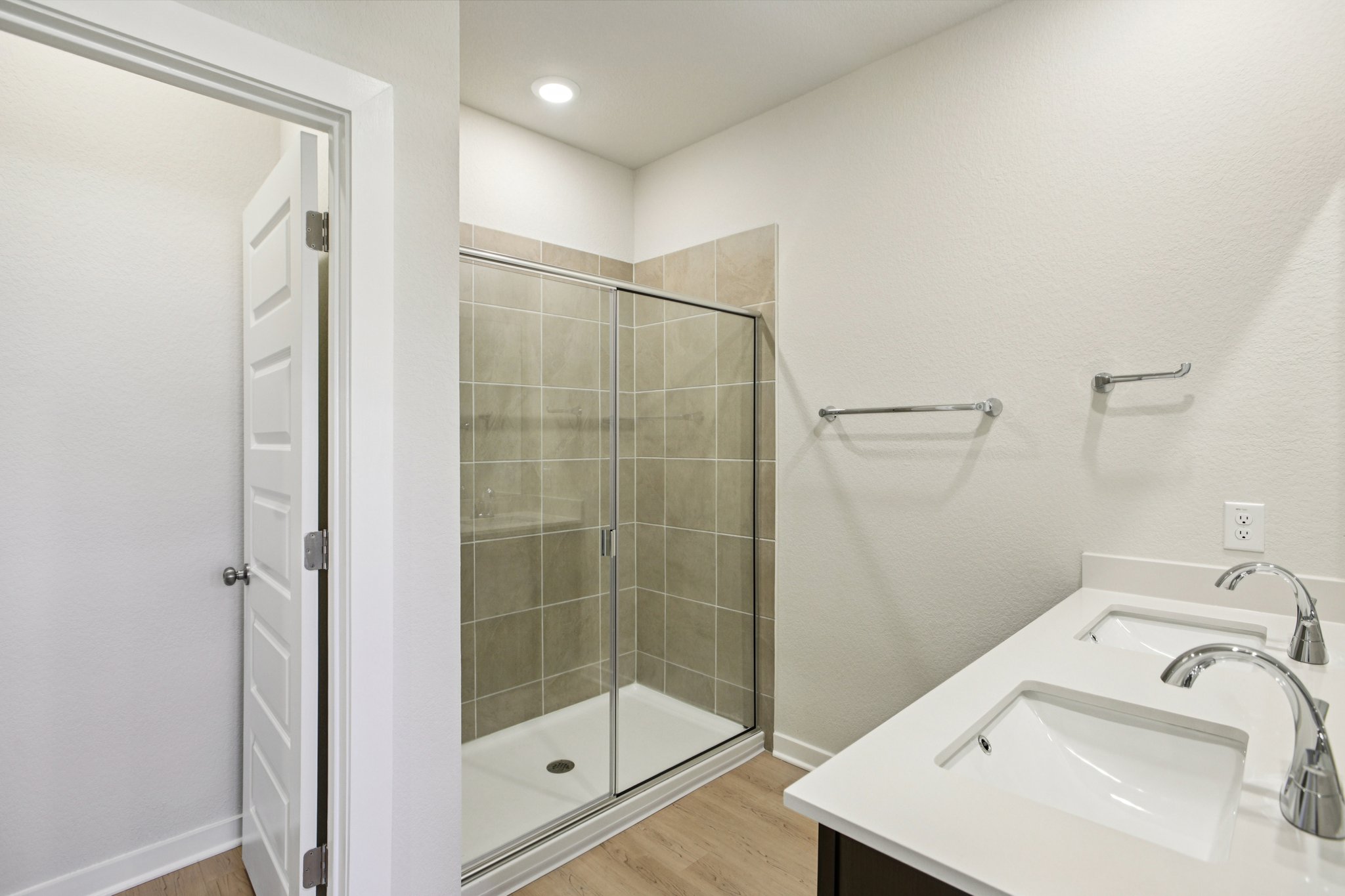 A bathroom with a glass shower.