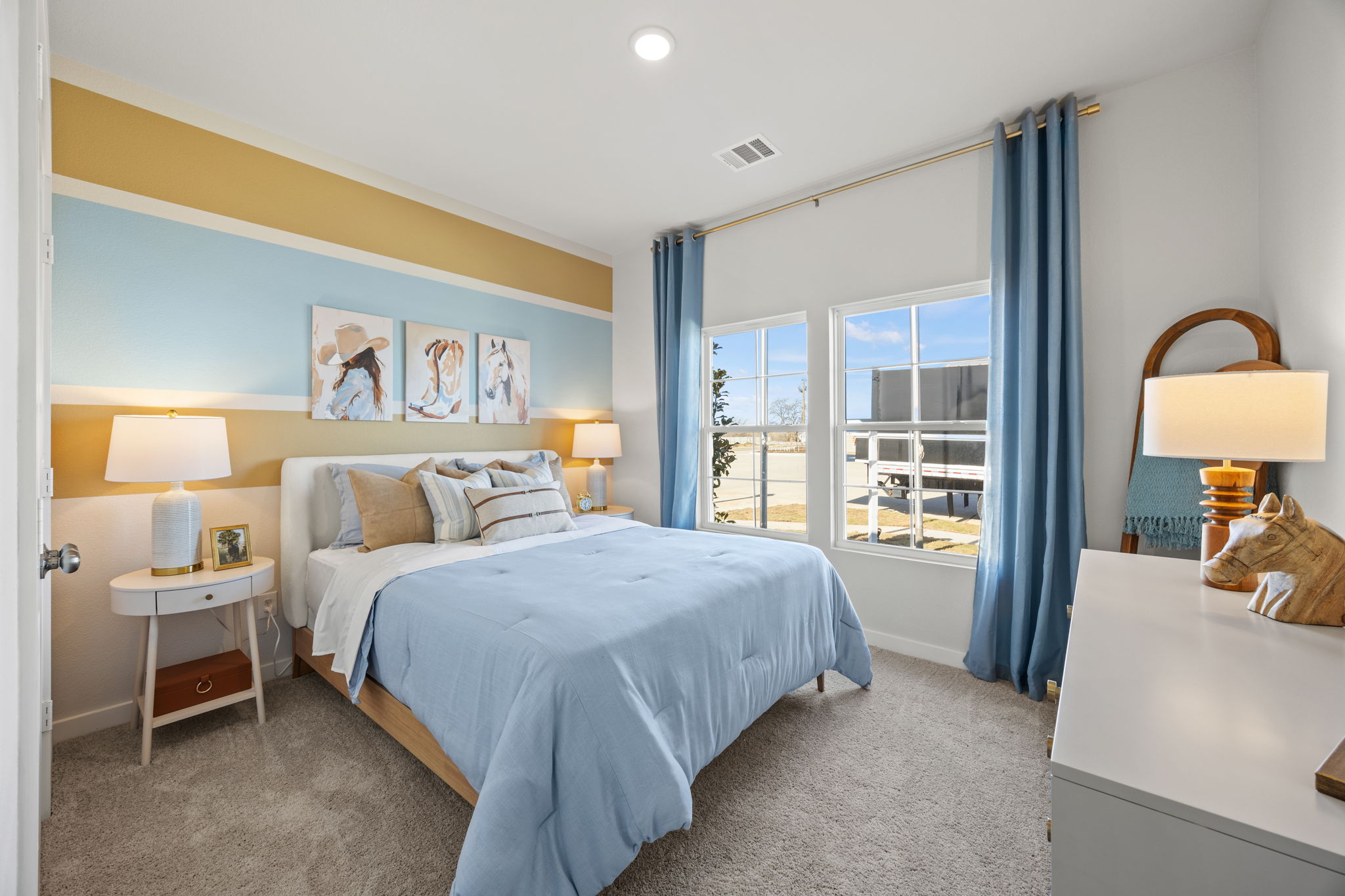 A bedroom with a bed and a window.