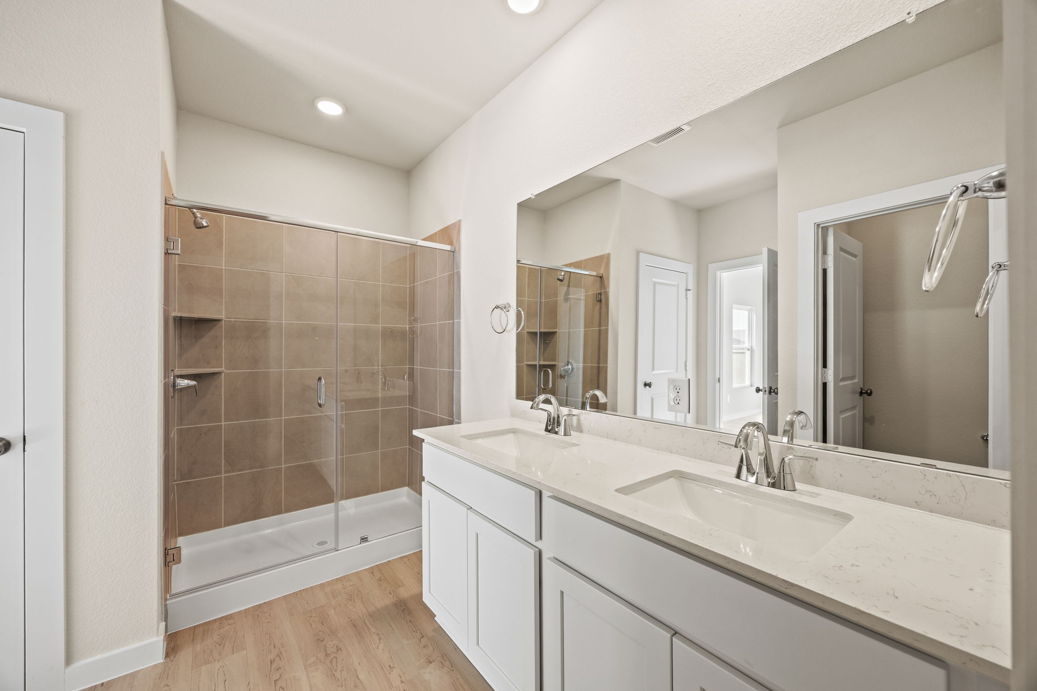 A bathroom with a glass shower.