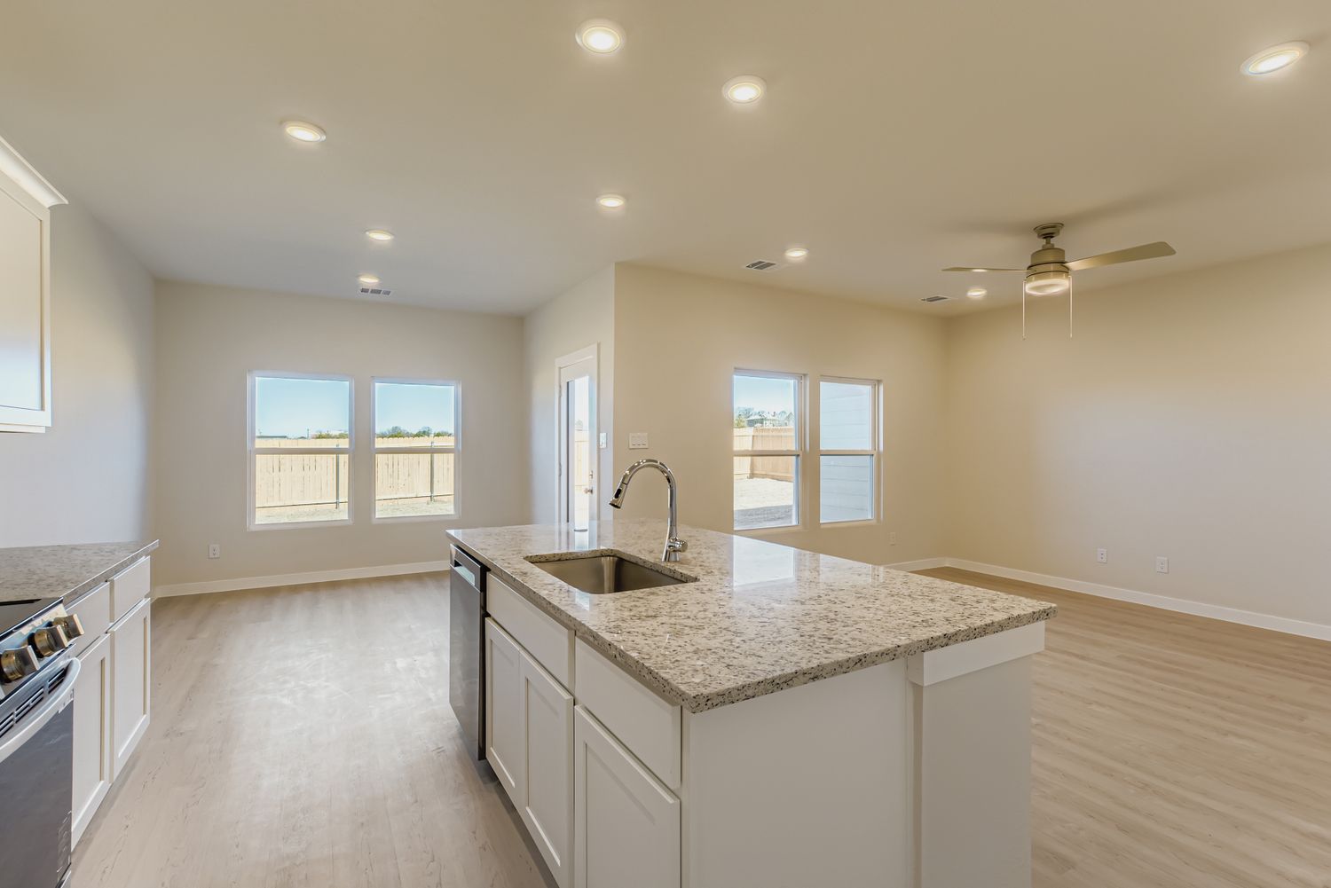A kitchen with a marble countertop.