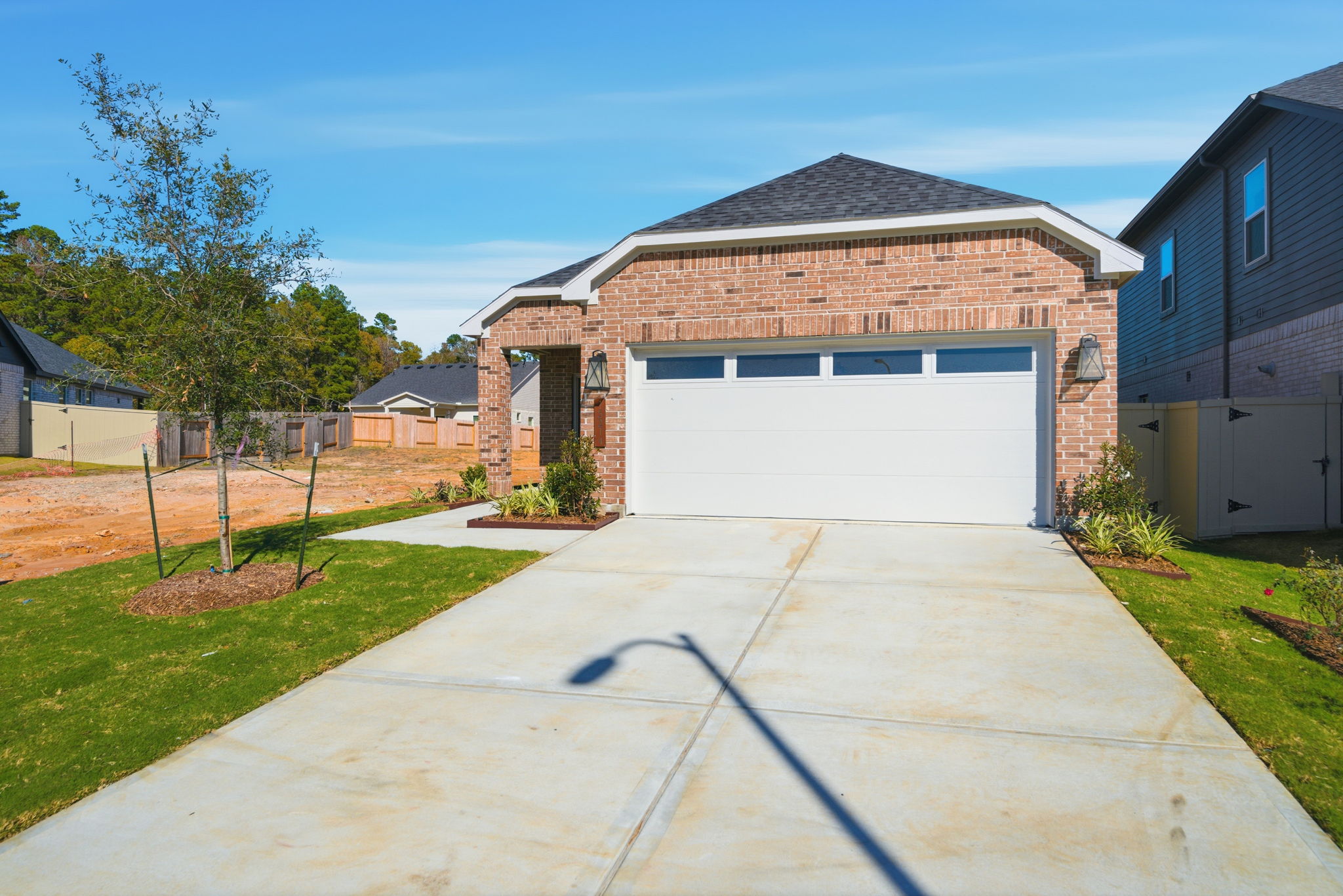A driveway leading to a house.