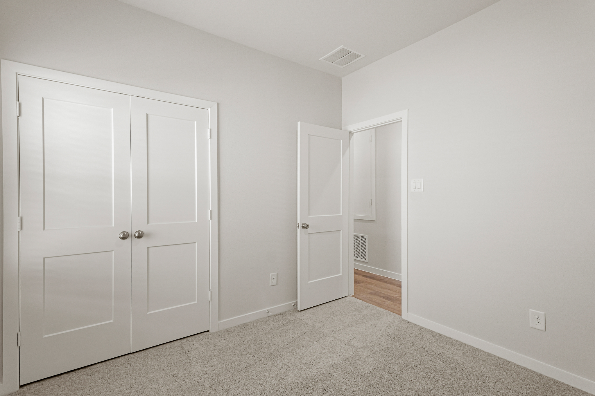 A room with white doors.