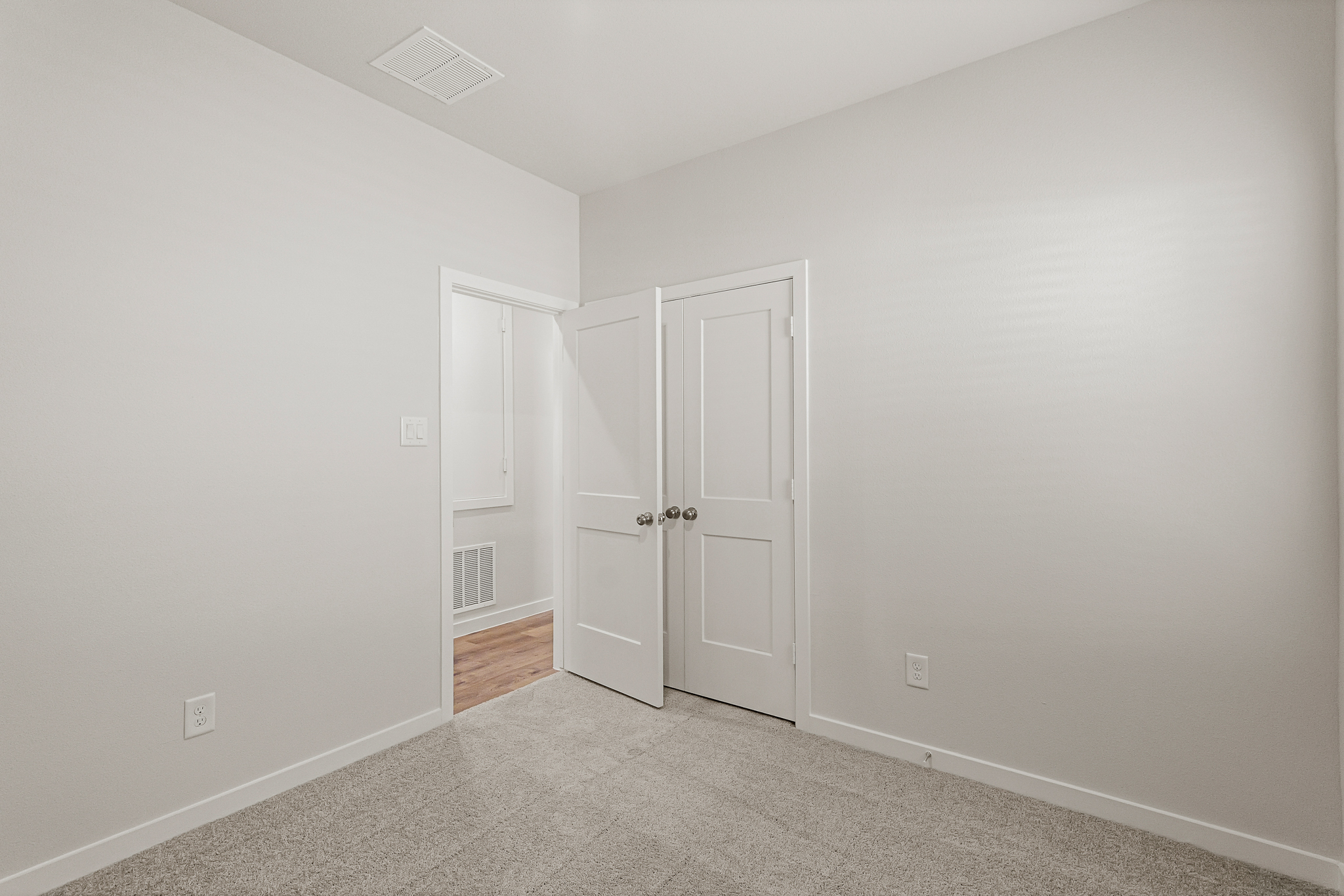 A room with white doors.