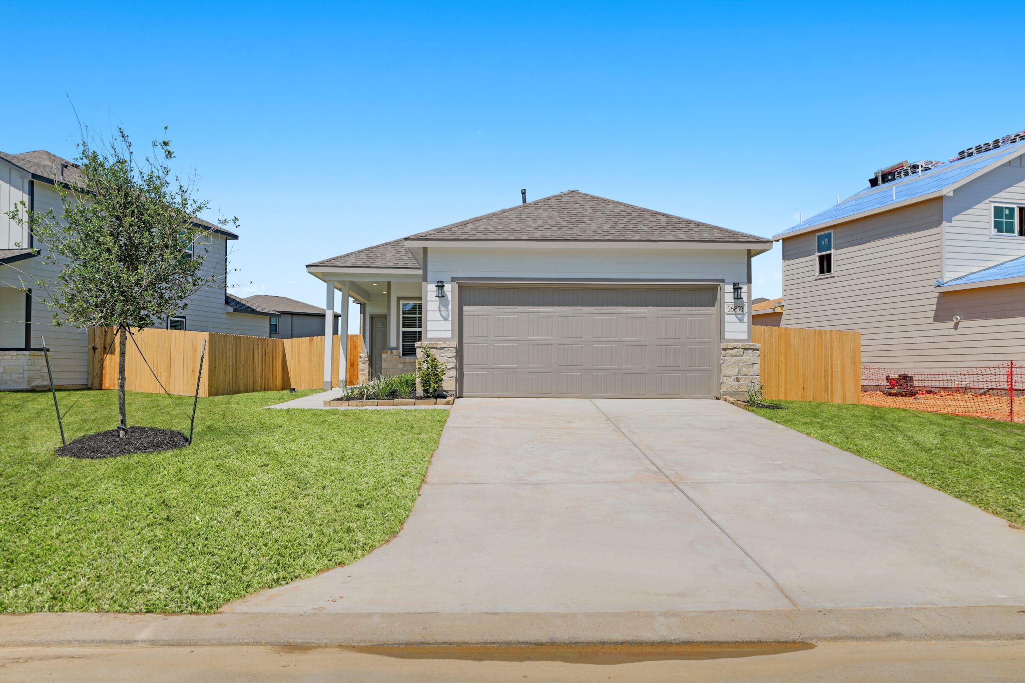 A driveway leading to a house.