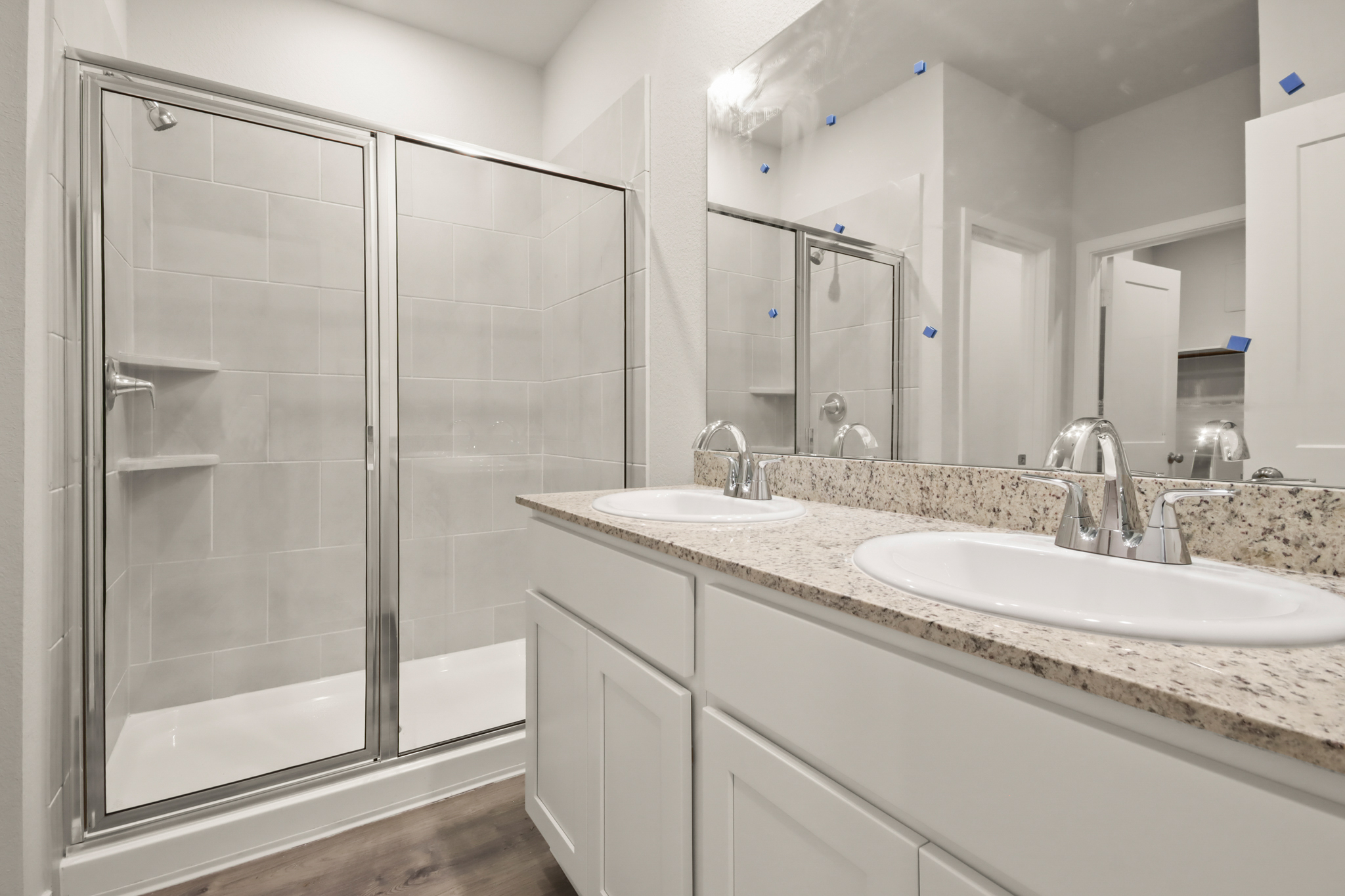 A bathroom with a glass shower.