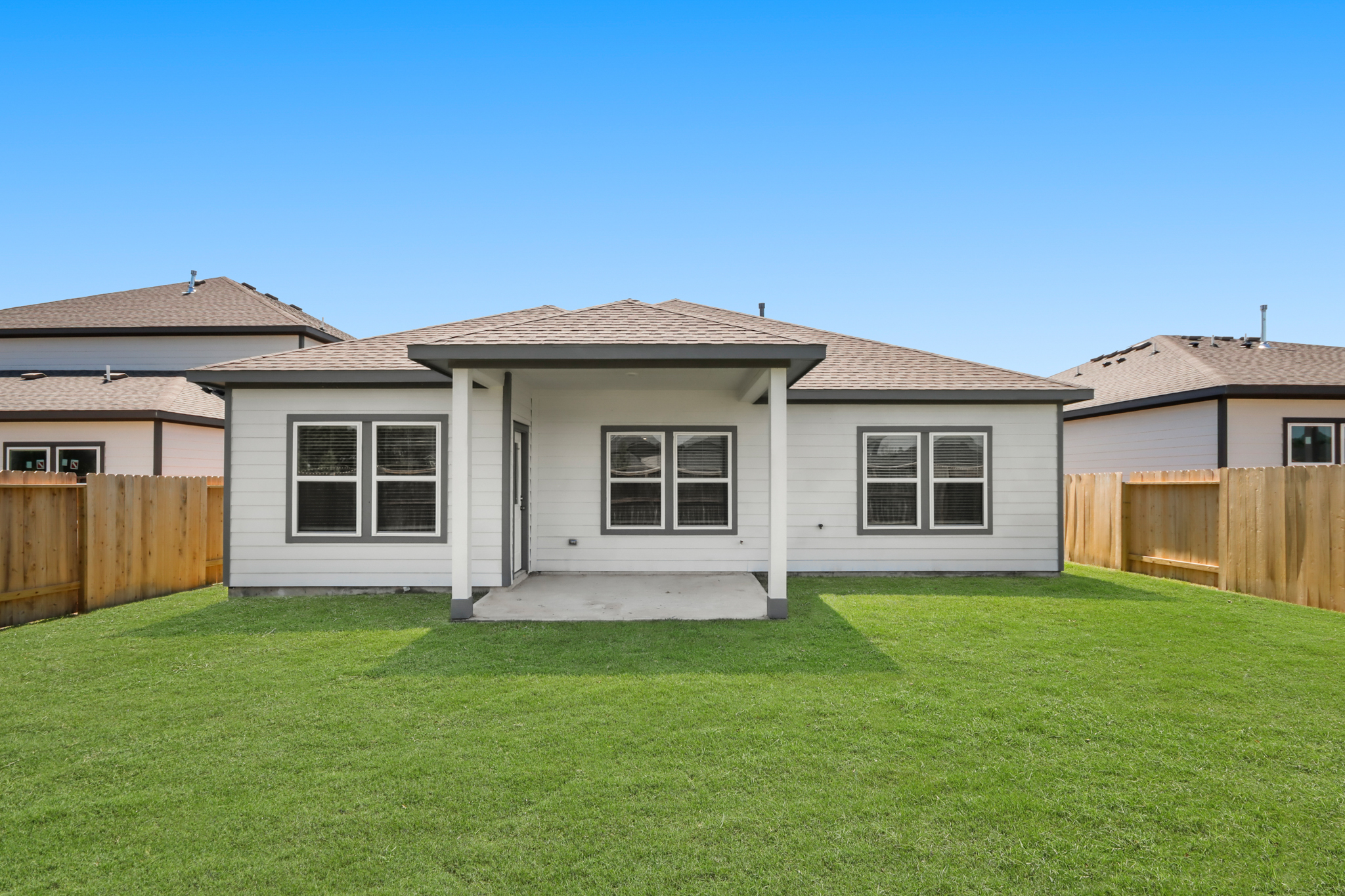 A house with a green lawn.