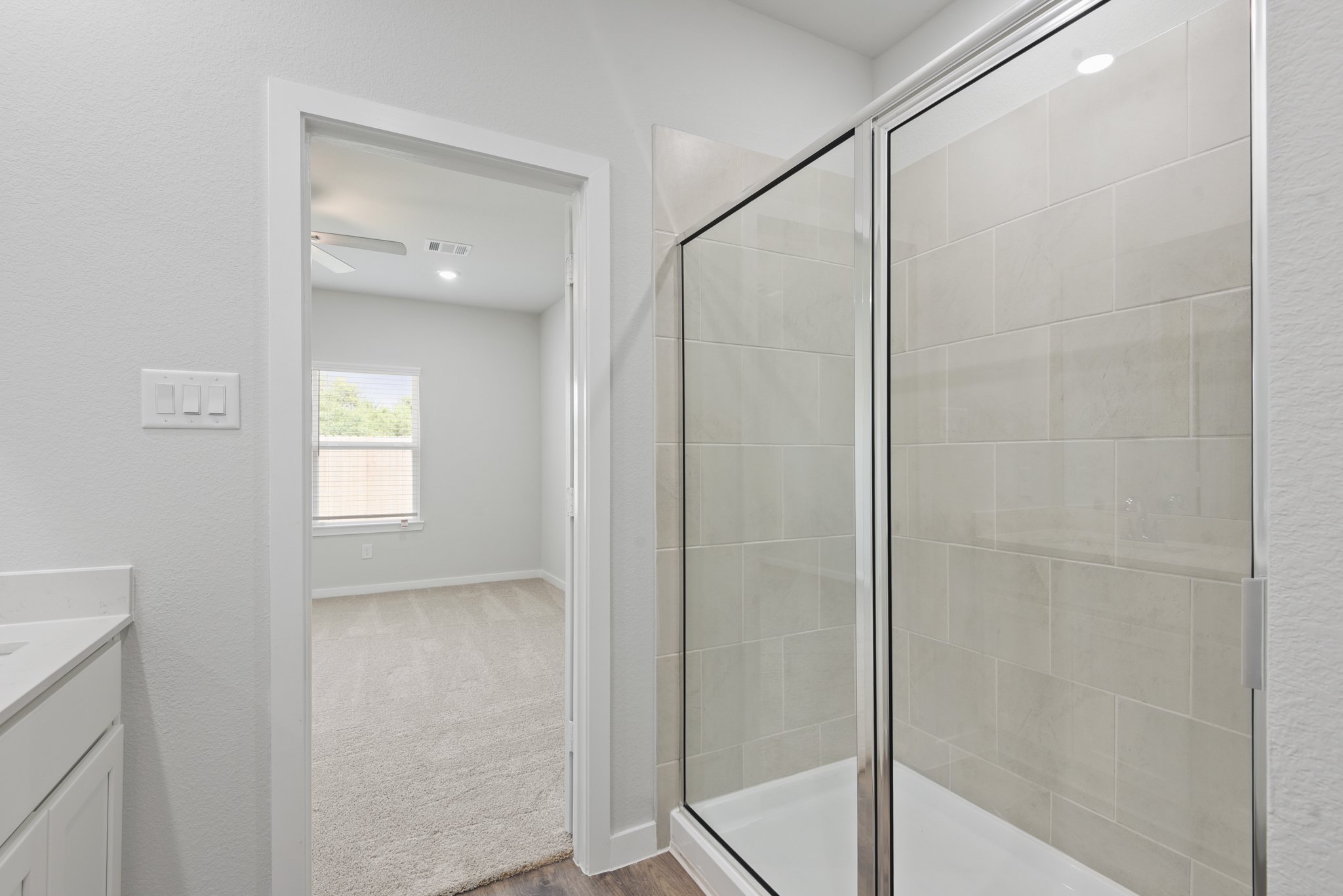 A bathroom with a glass shower.
